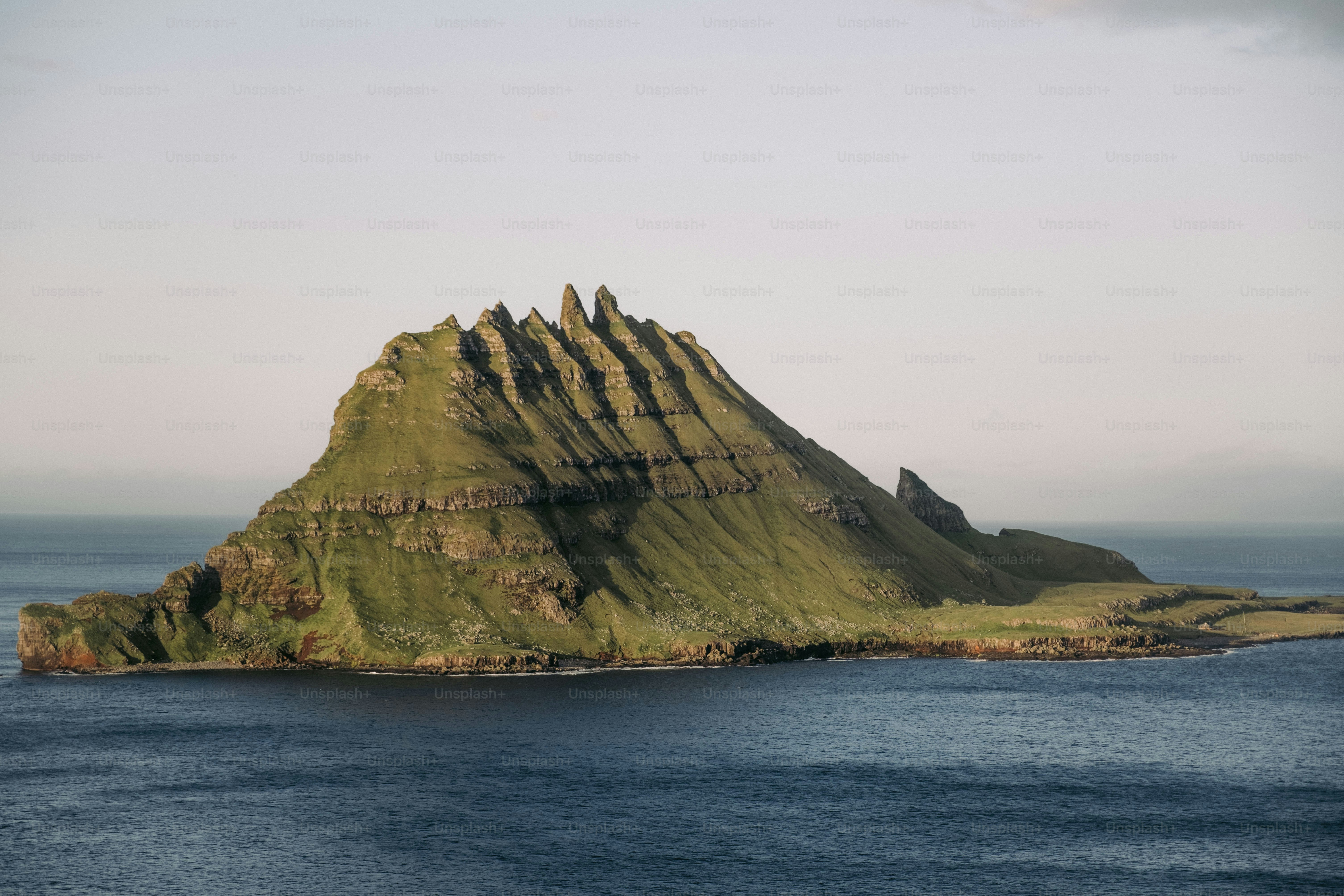 A small island in the middle of a body of water