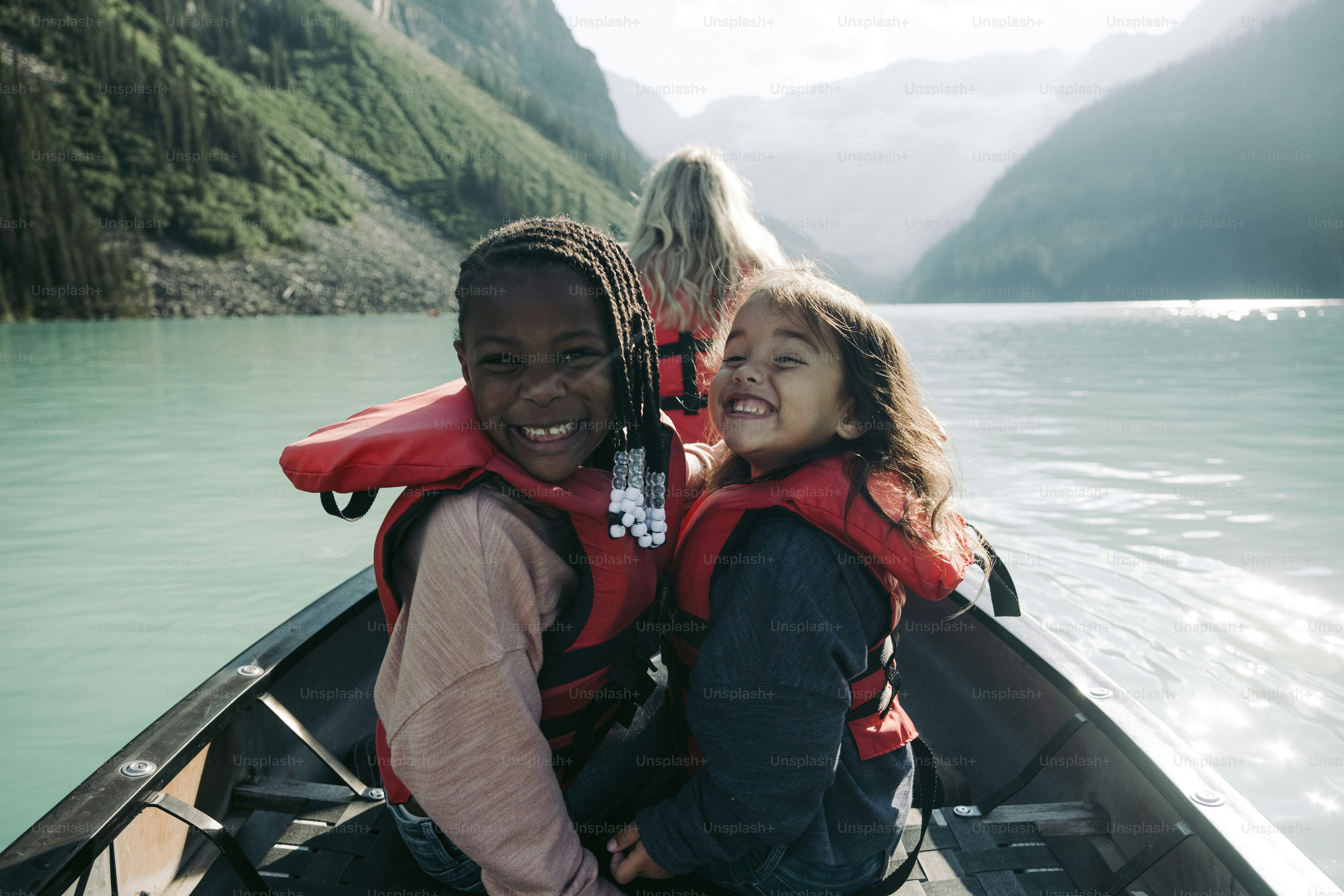 A man and a woman in a boat on a lake