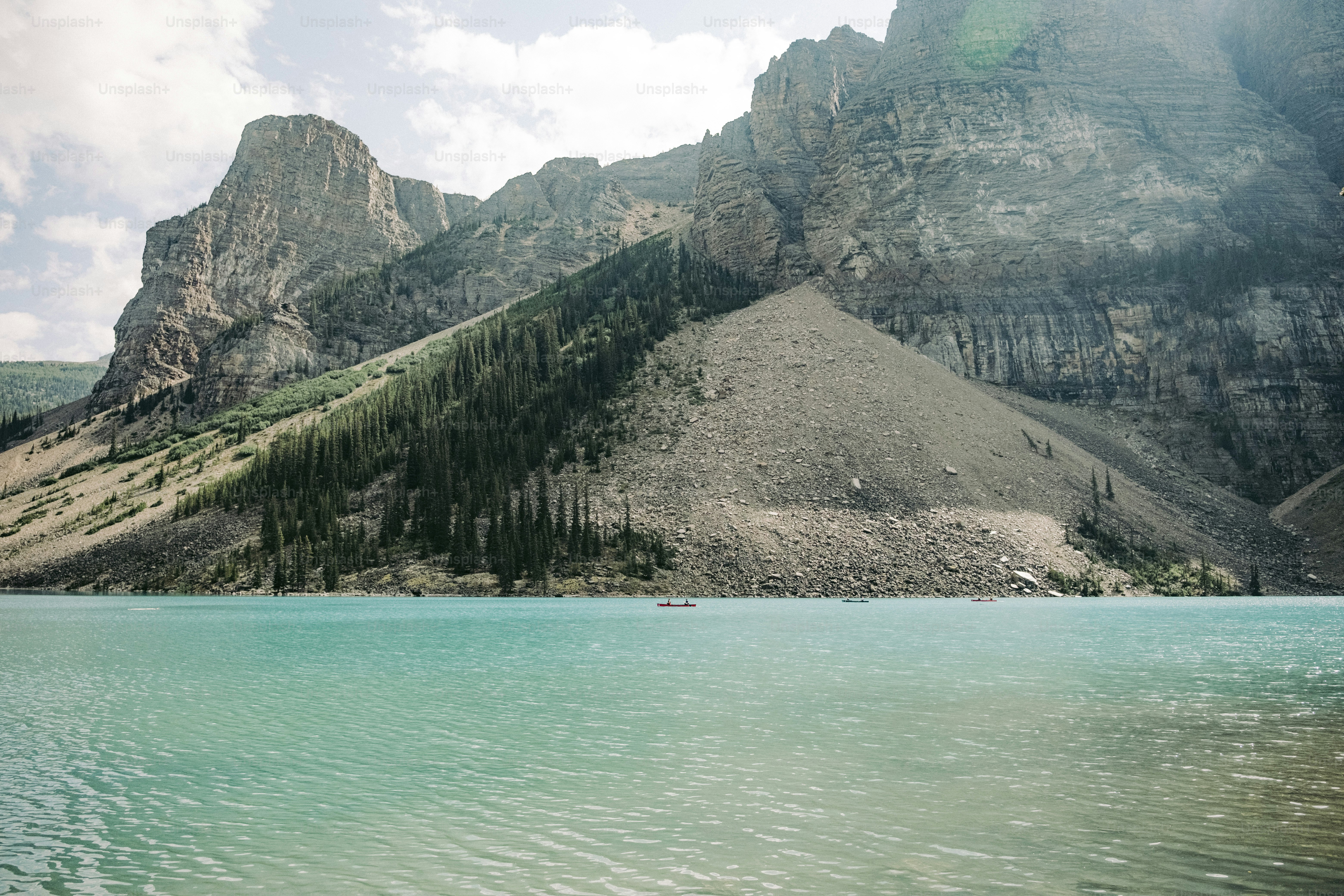 A large body of water with mountains in the background