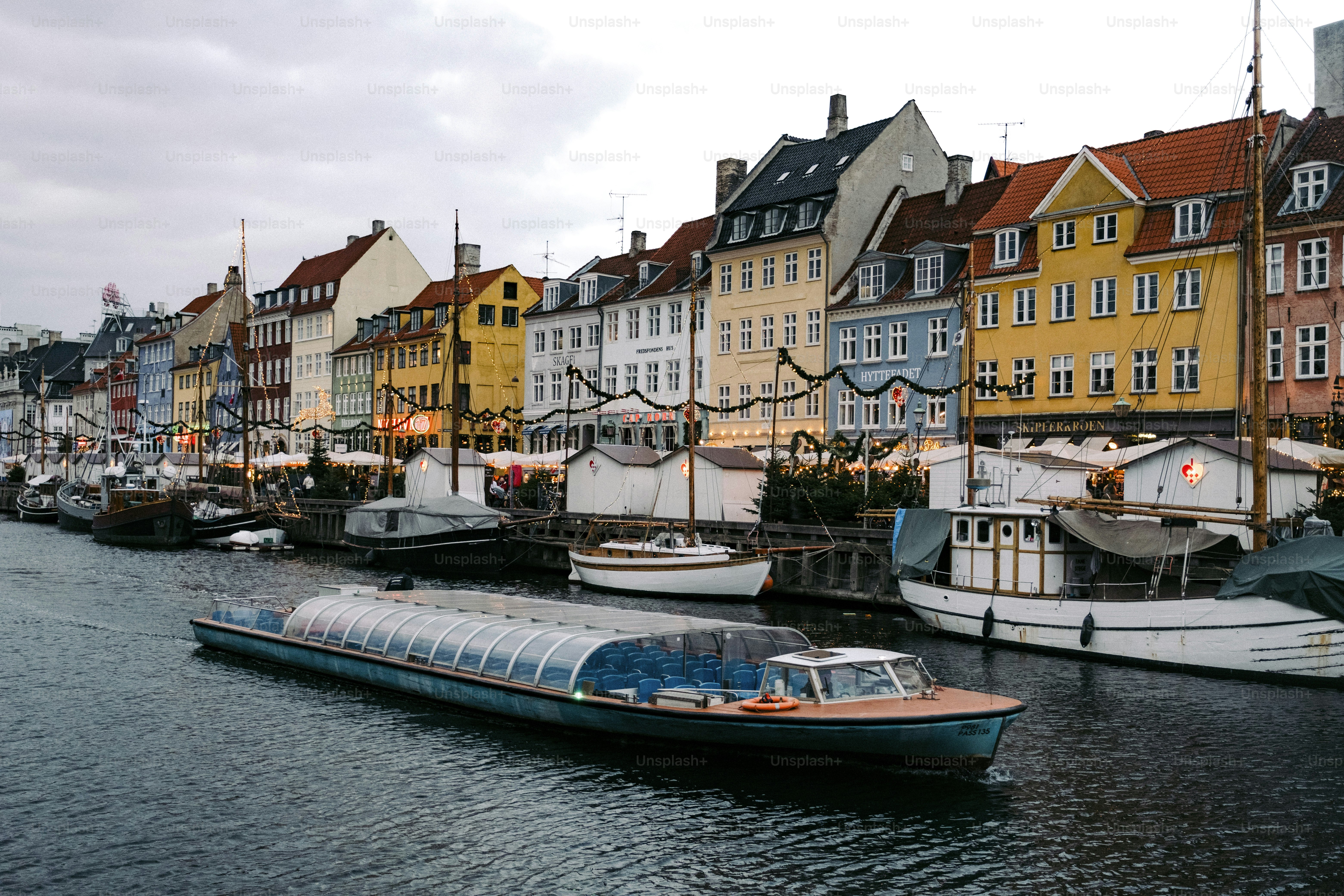 A row of boats sitting next to each other on a body of water