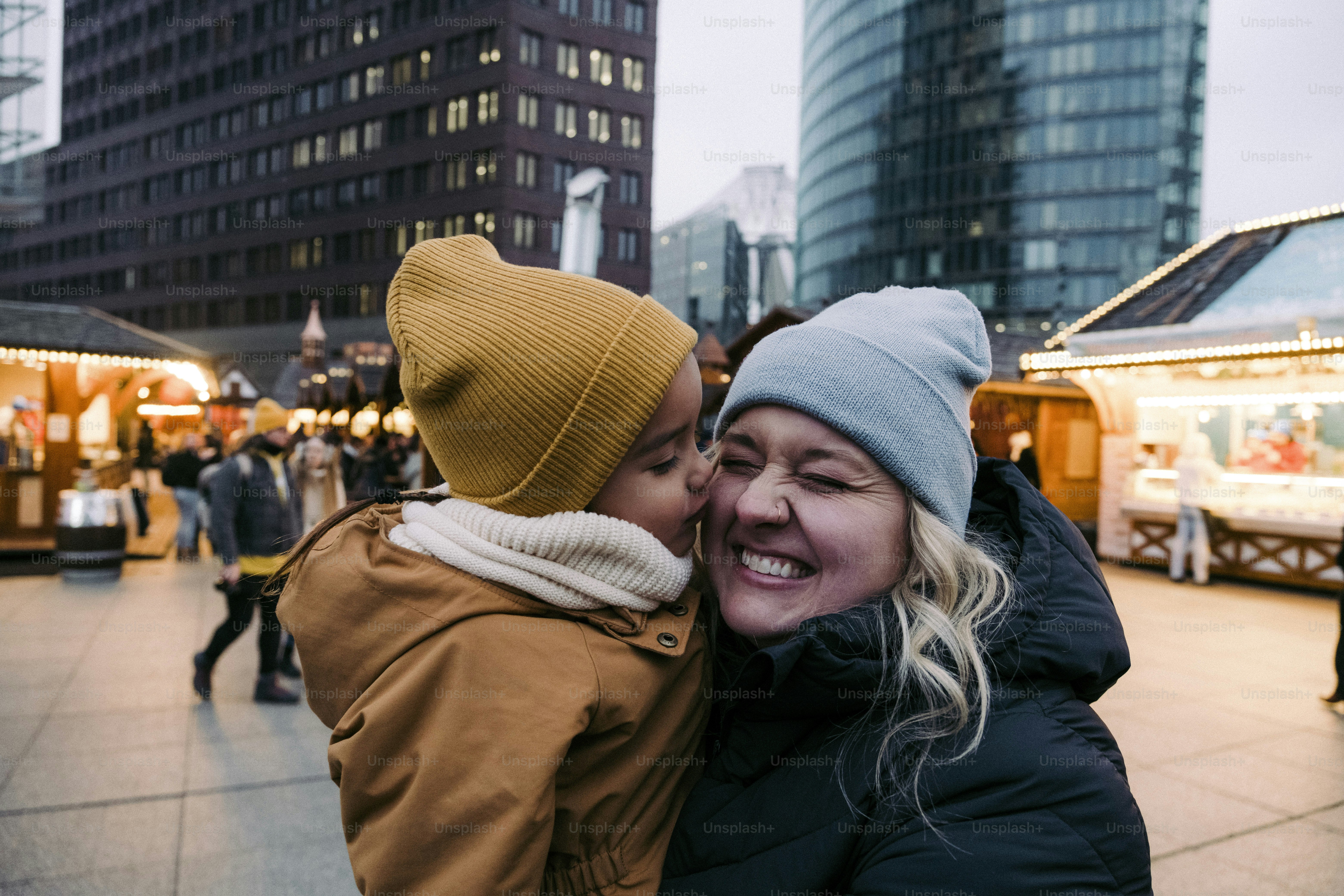 A woman hugging another woman on the street
