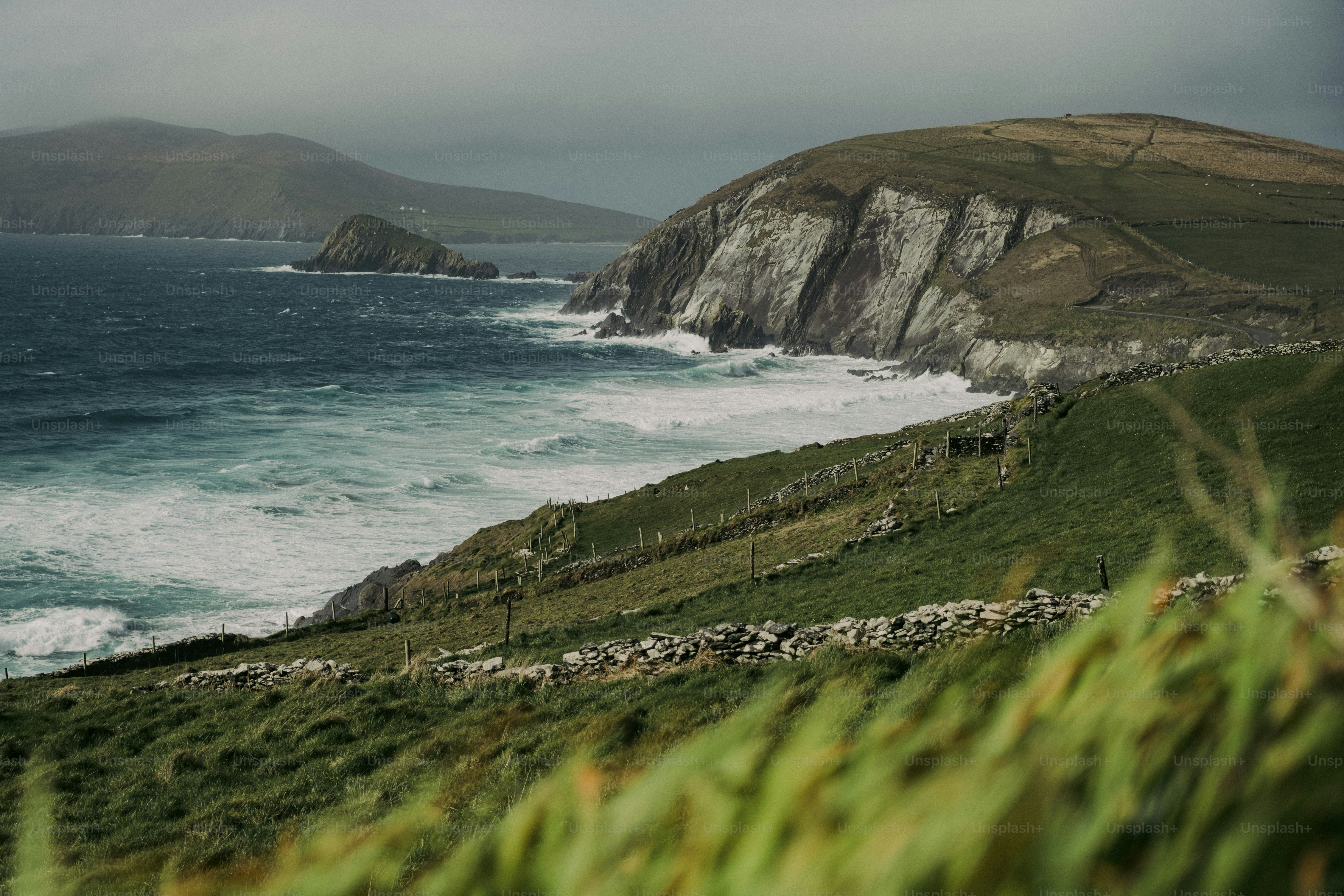 A view of the ocean from the top of a hill
