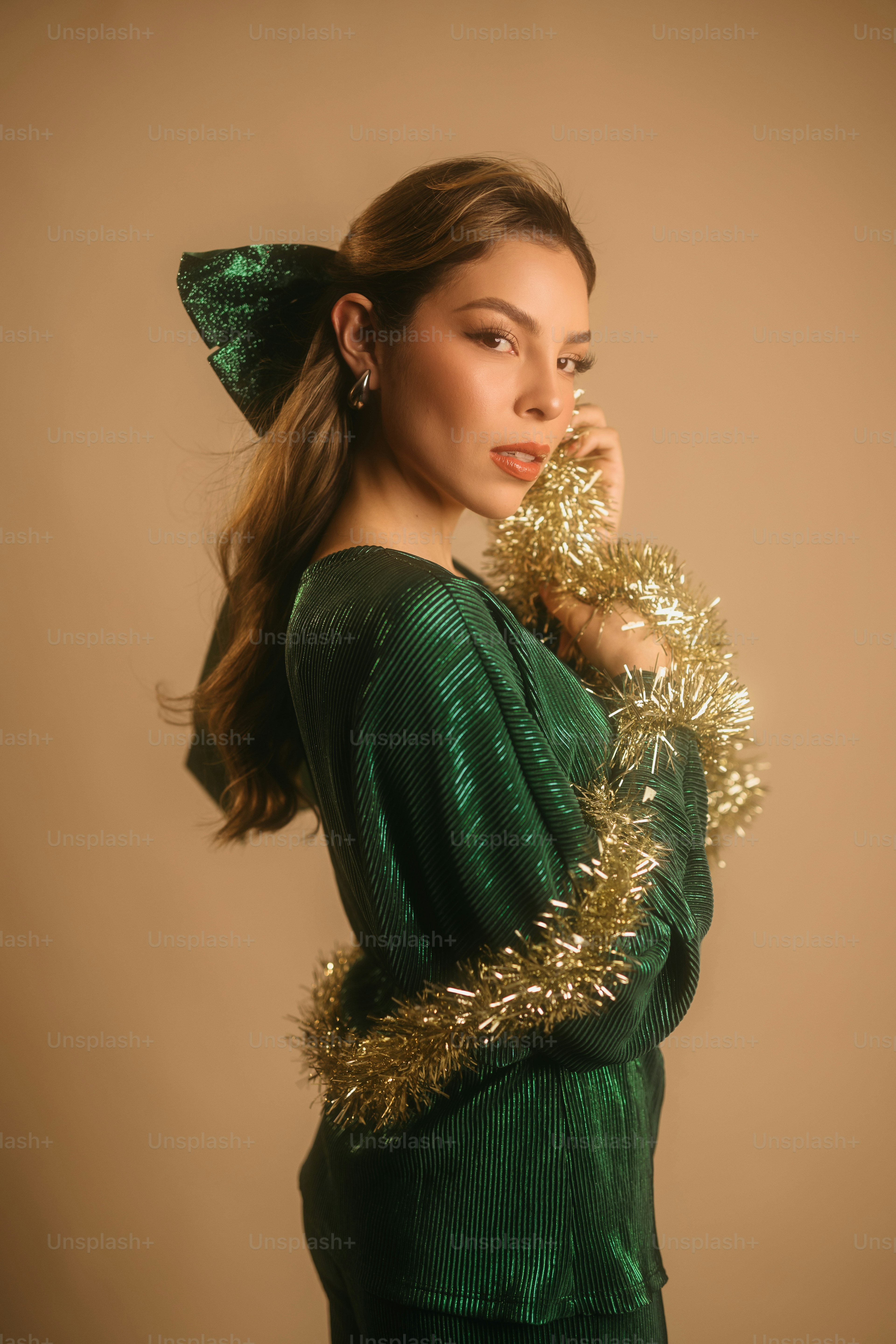 A woman wearing a green dress and a green hat