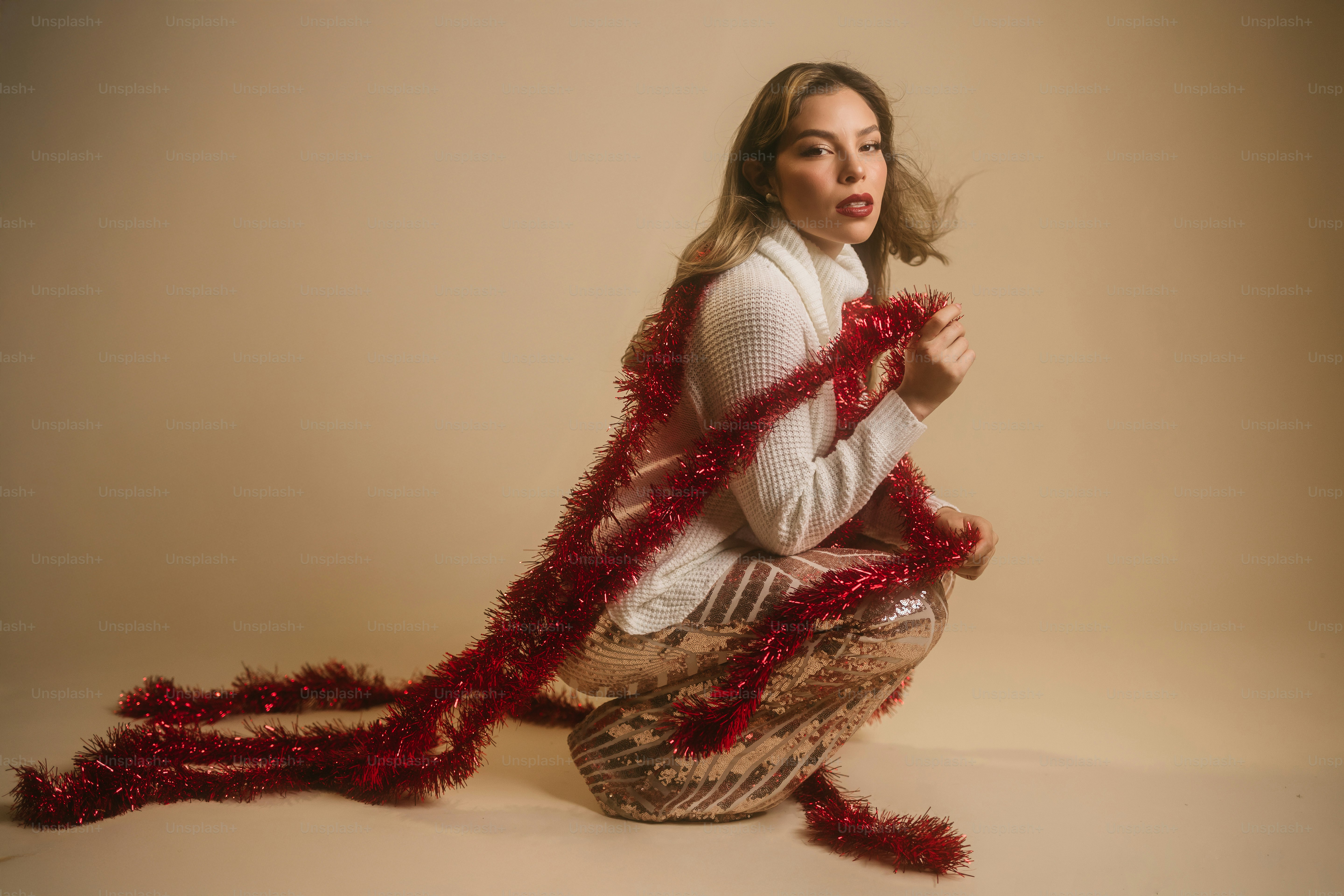 A woman in a white shirt and a red scarf