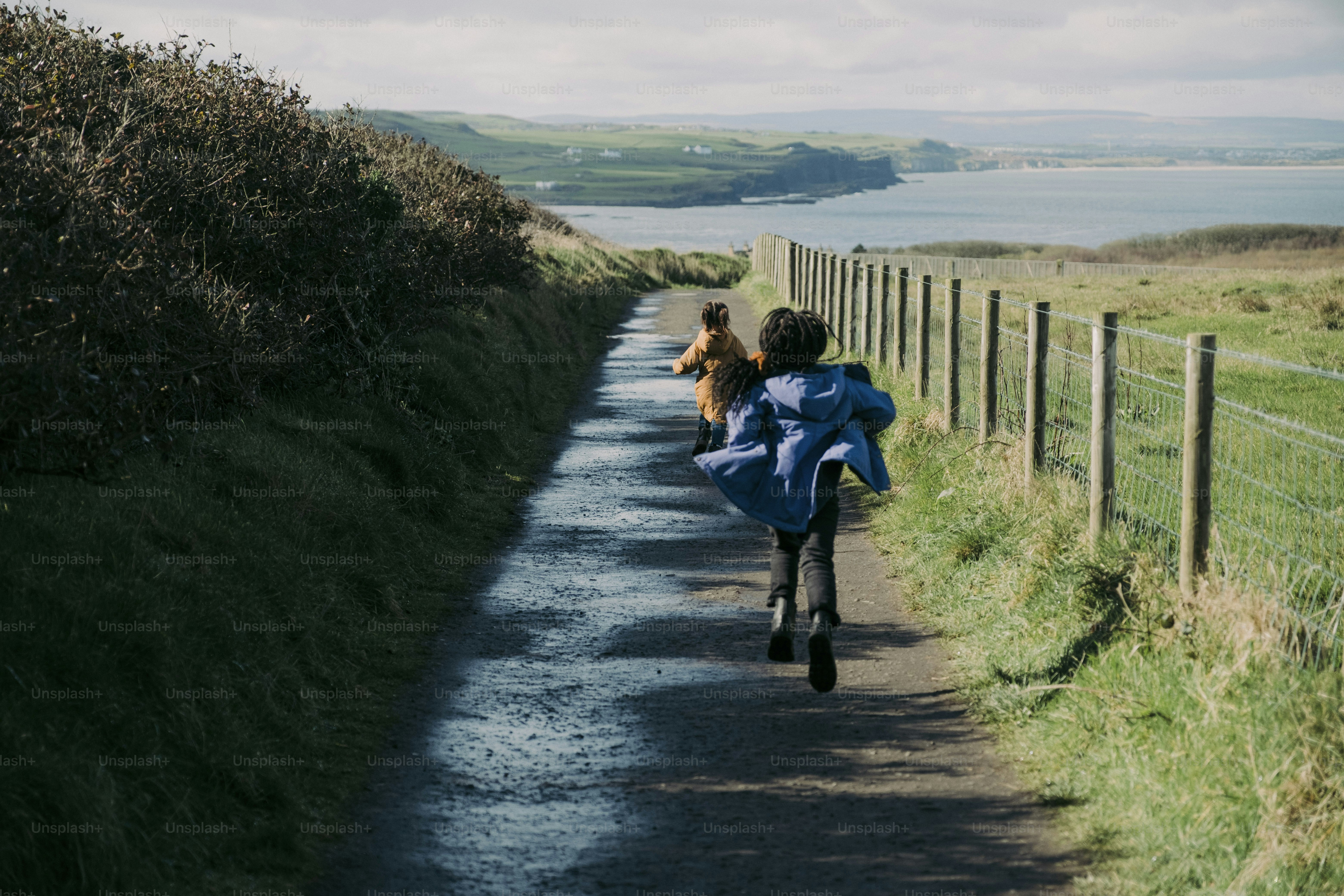 A person riding a bike down a dirt road