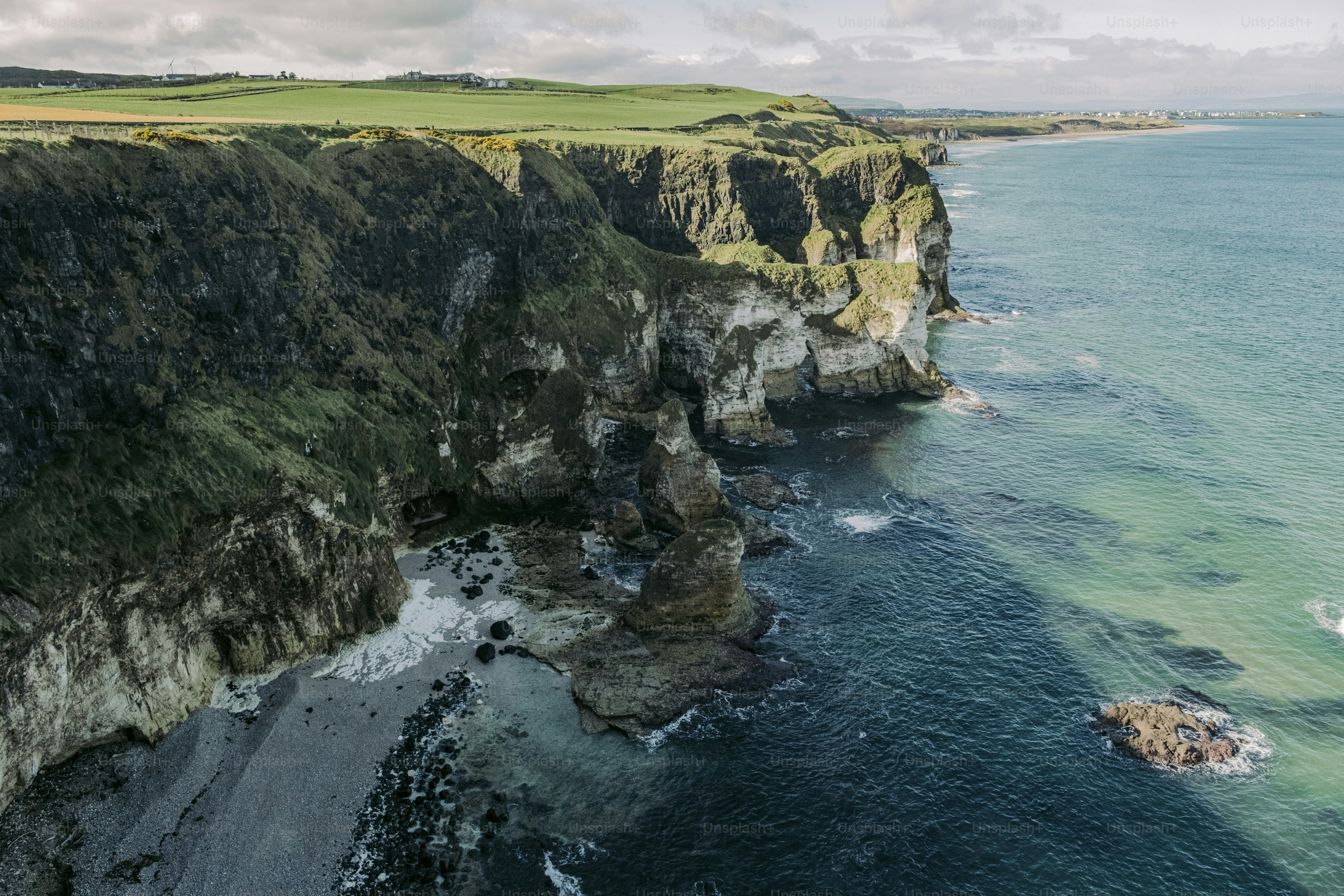 An aerial view of the ocean and cliffs
