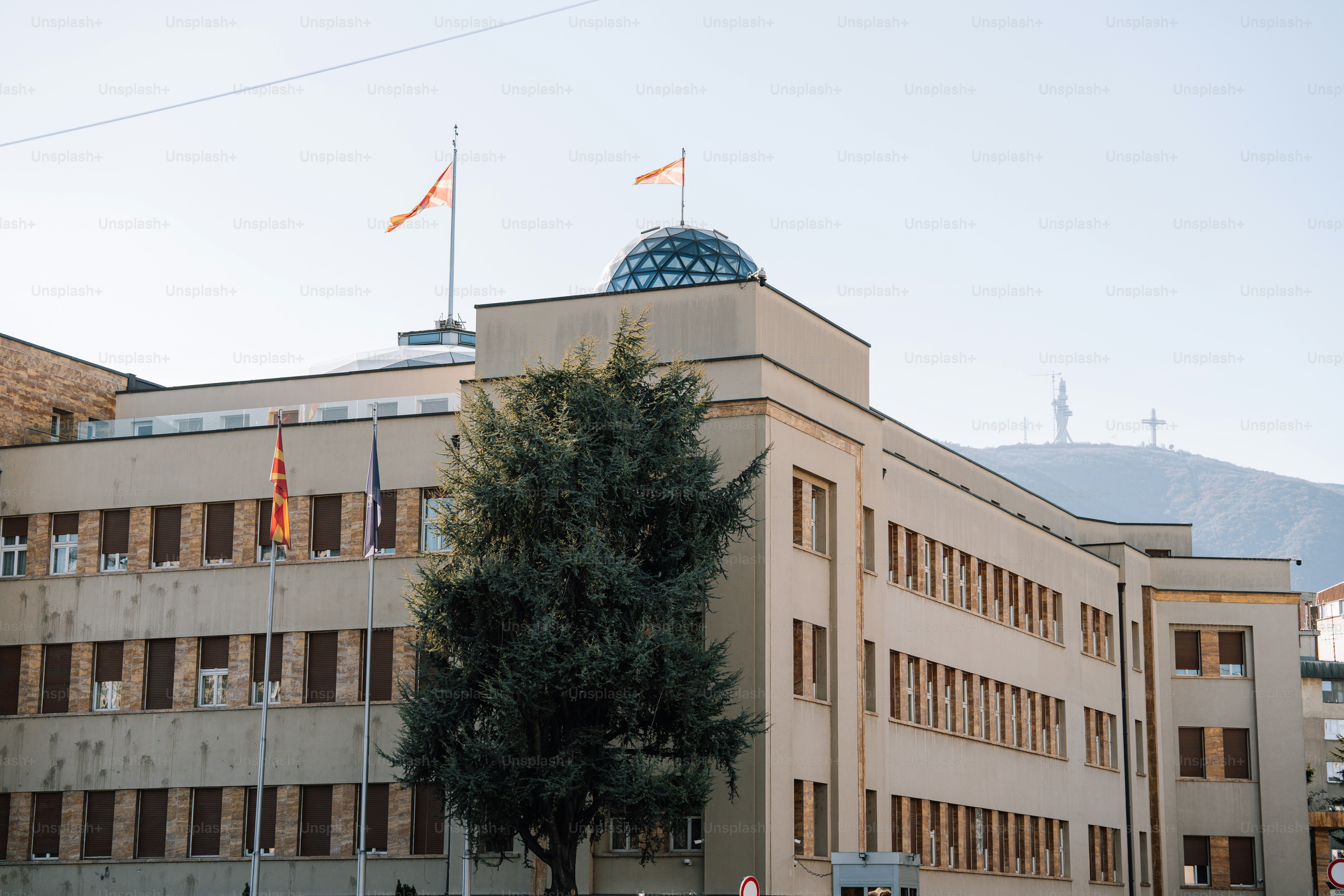 A large building with a flag on top of it