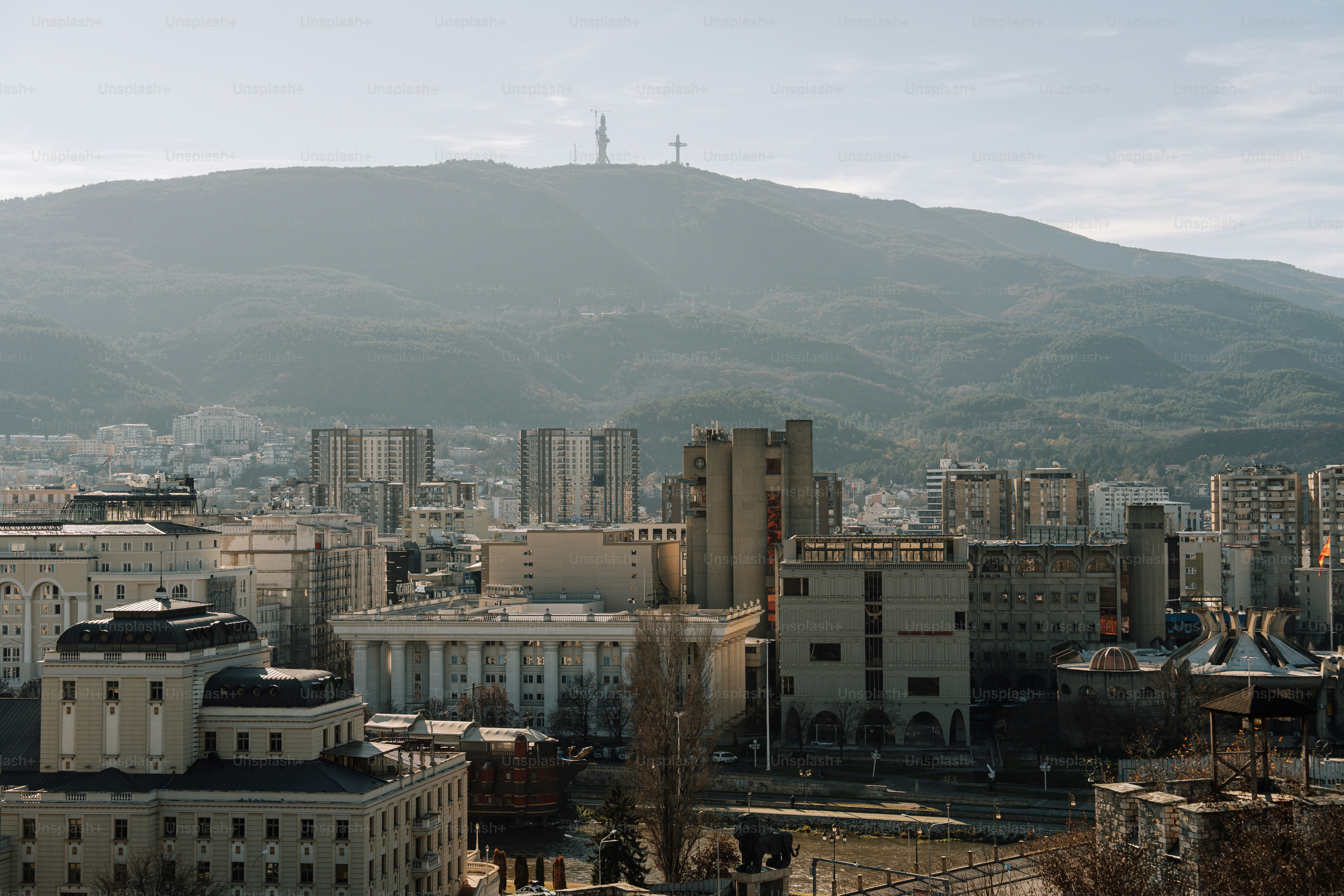 A view of a city with mountains in the background