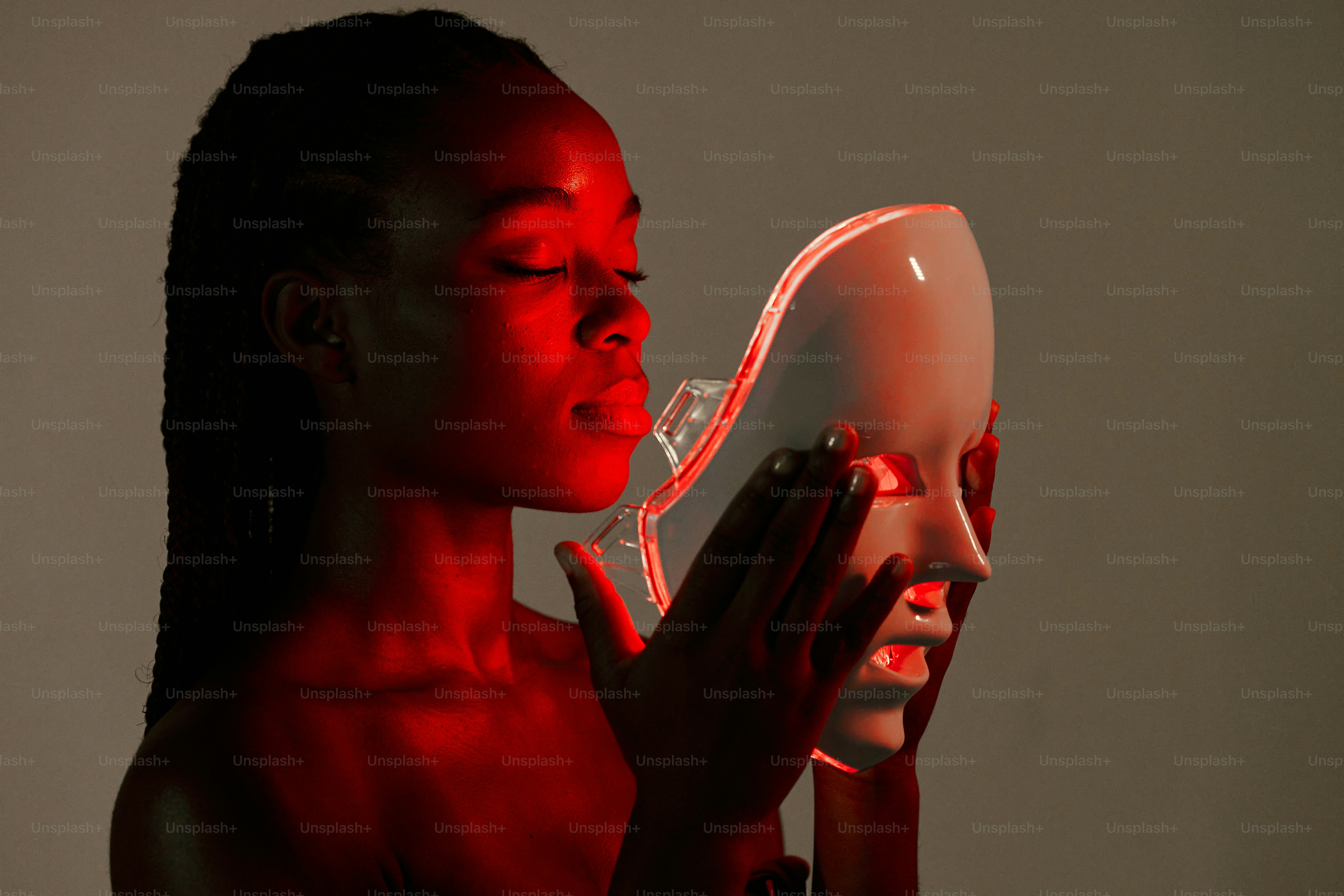 A woman holding a blow dryer in her hand