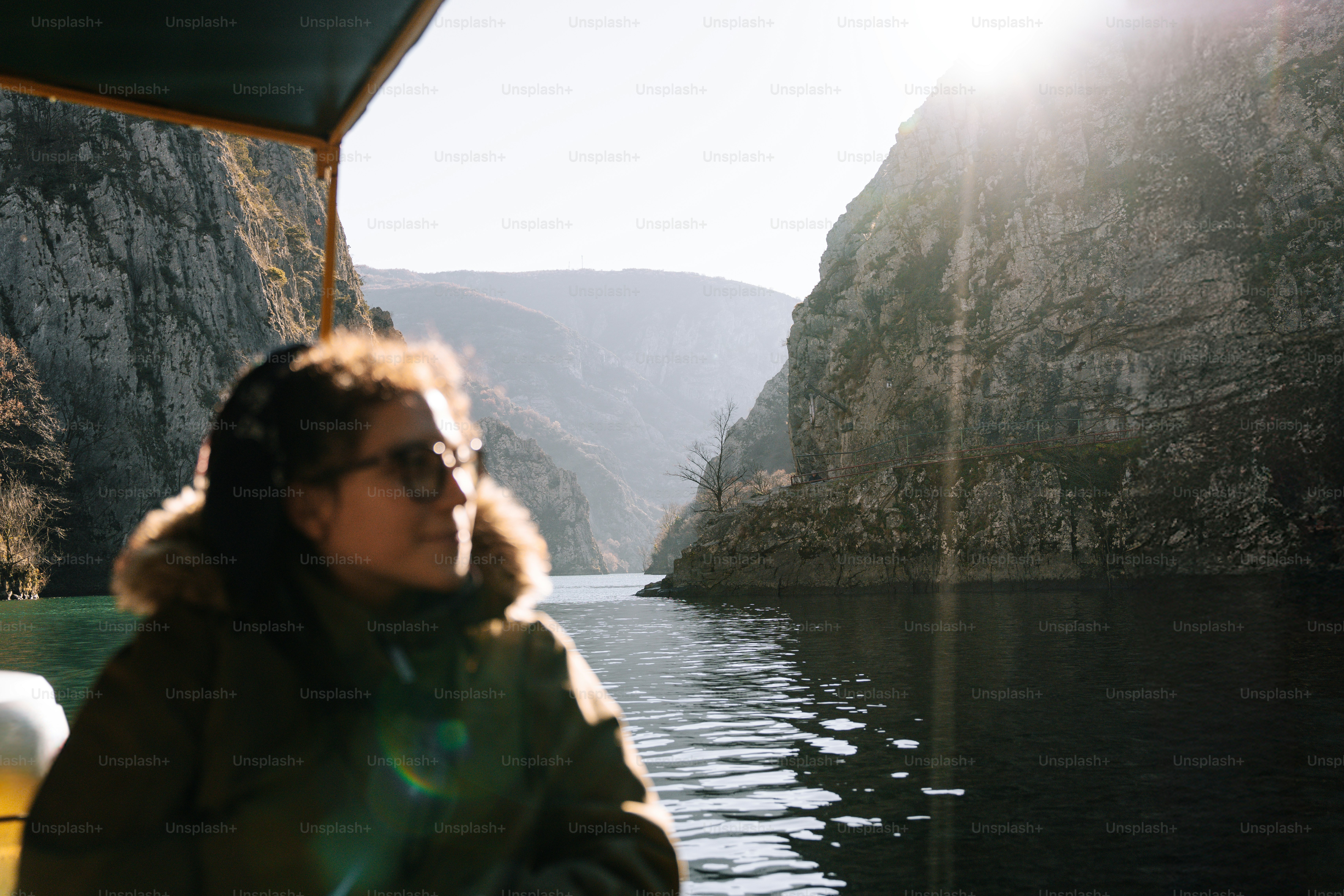 A woman sitting on a boat in the water