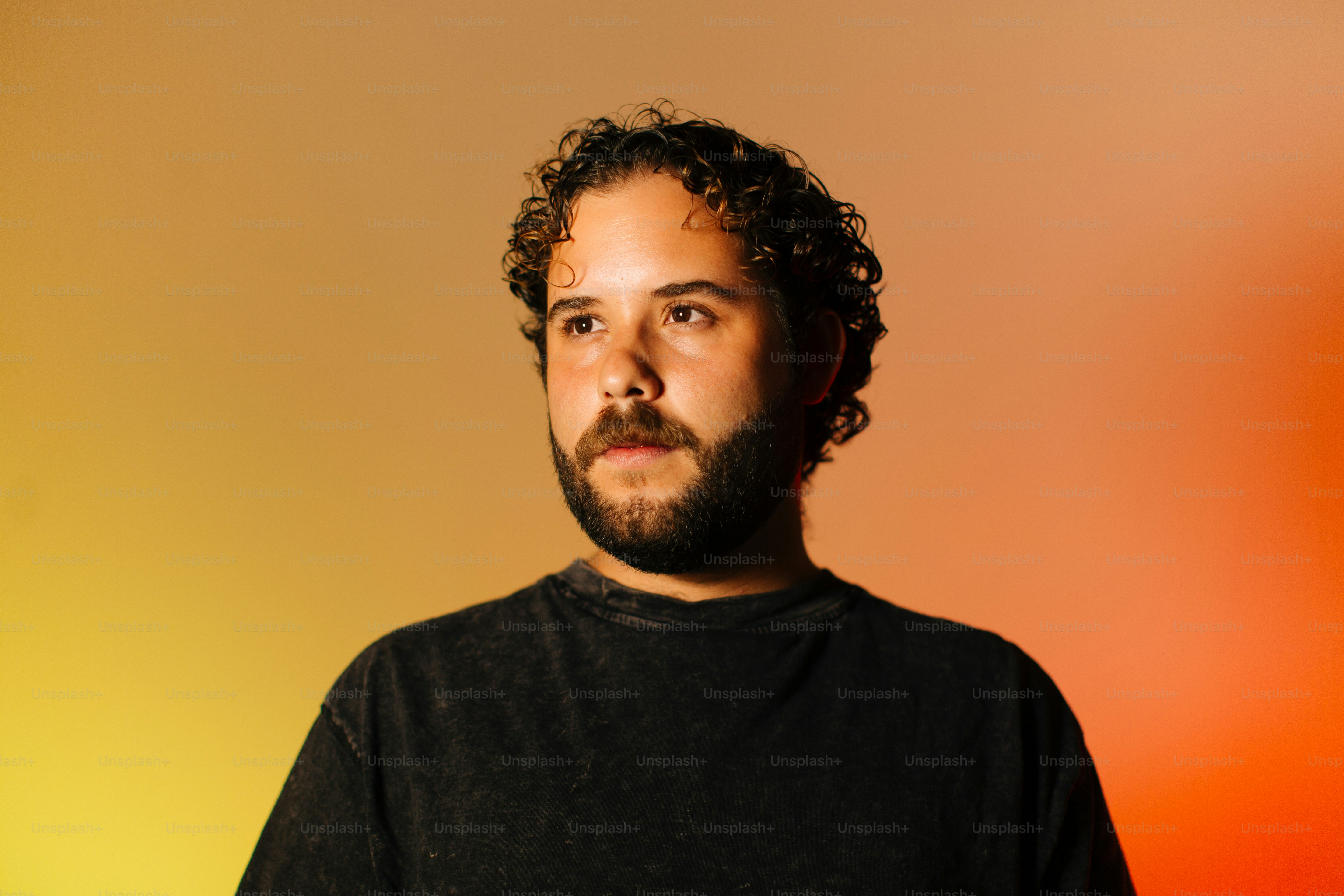 A man with a beard and a black shirt