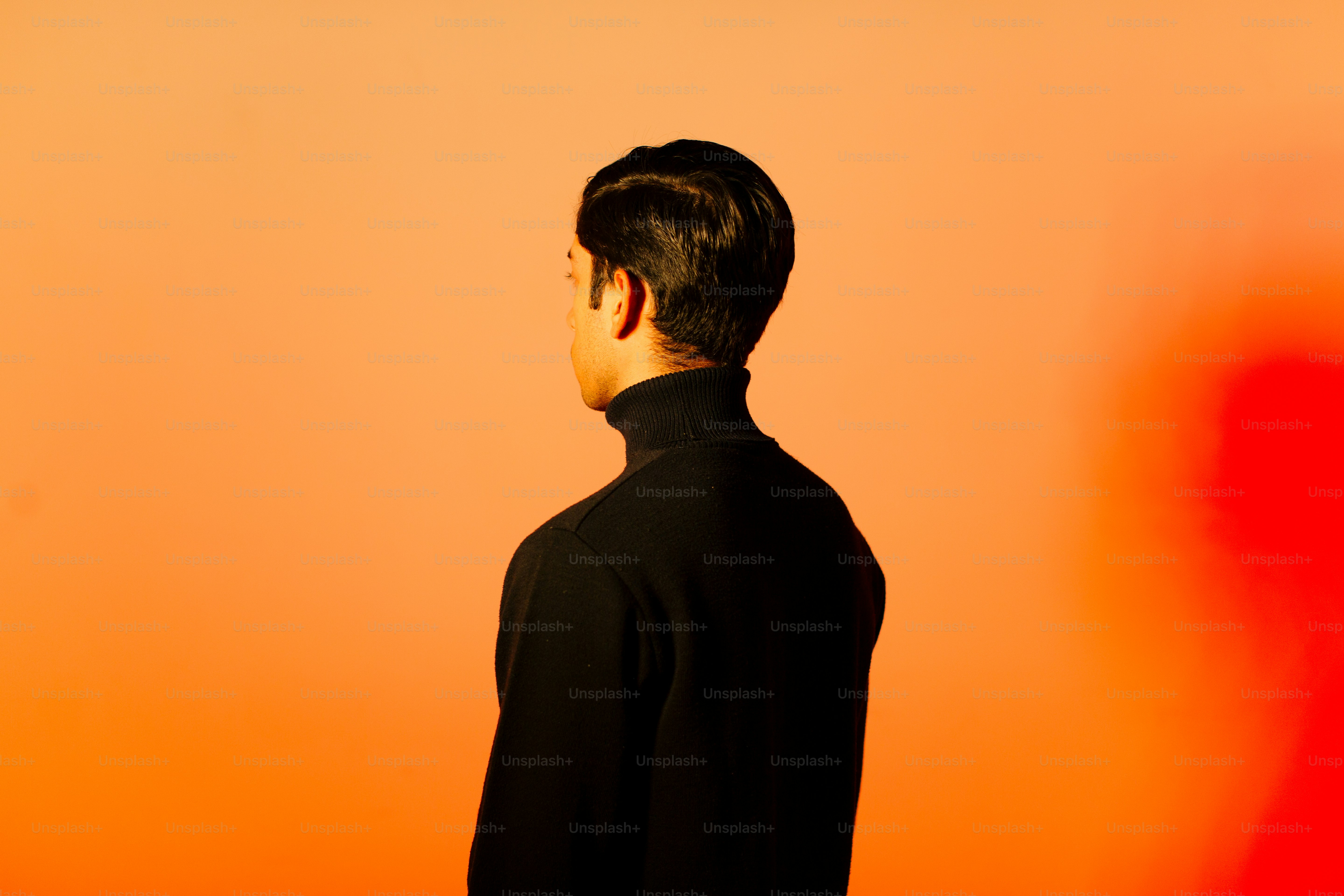 A man standing in front of an orange wall photo – Gradient portrait ...