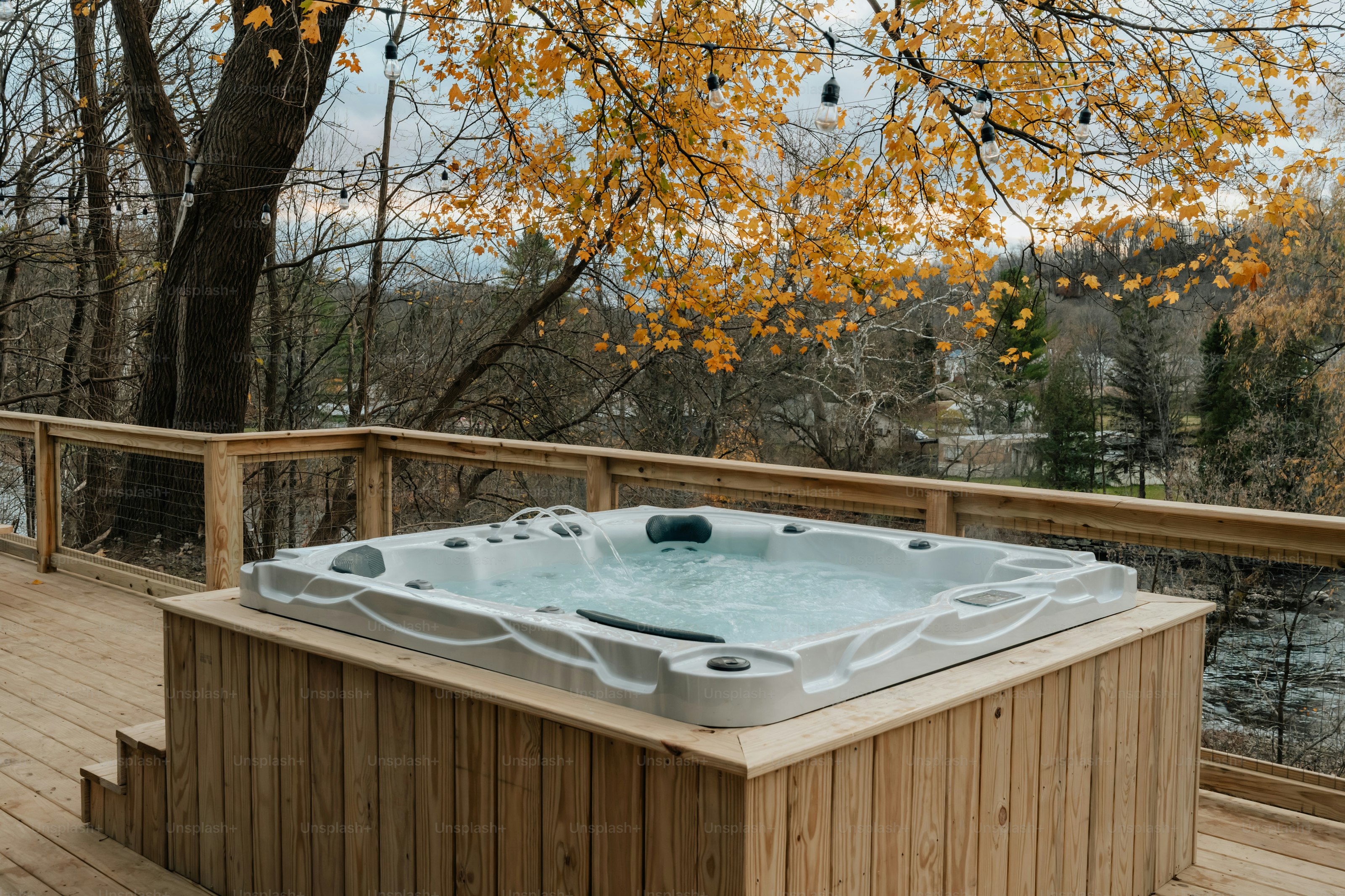 A hot tub sitting on top of a wooden deck