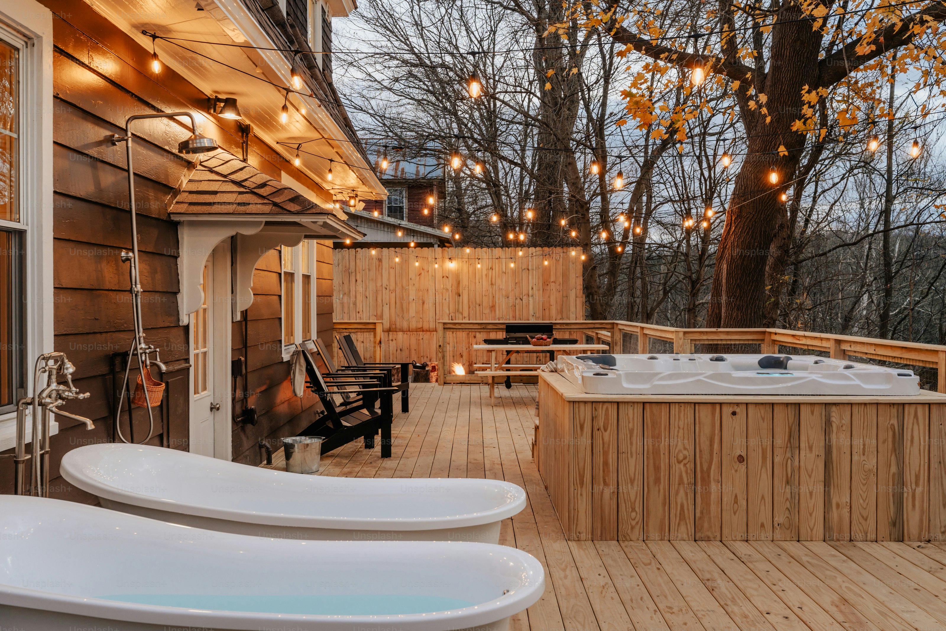 A hot tub sitting on top of a wooden deck