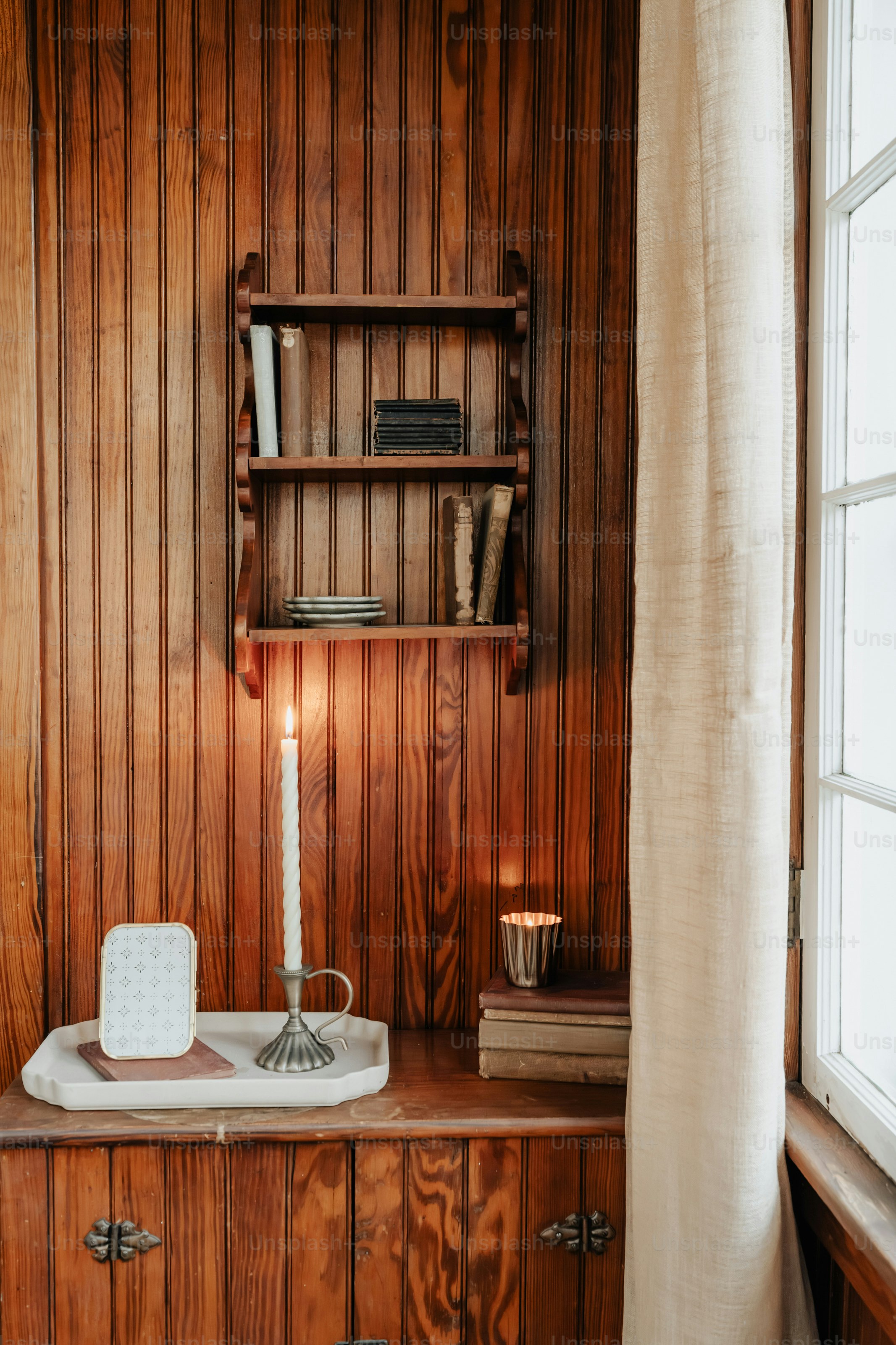 A room with wood paneling and a window