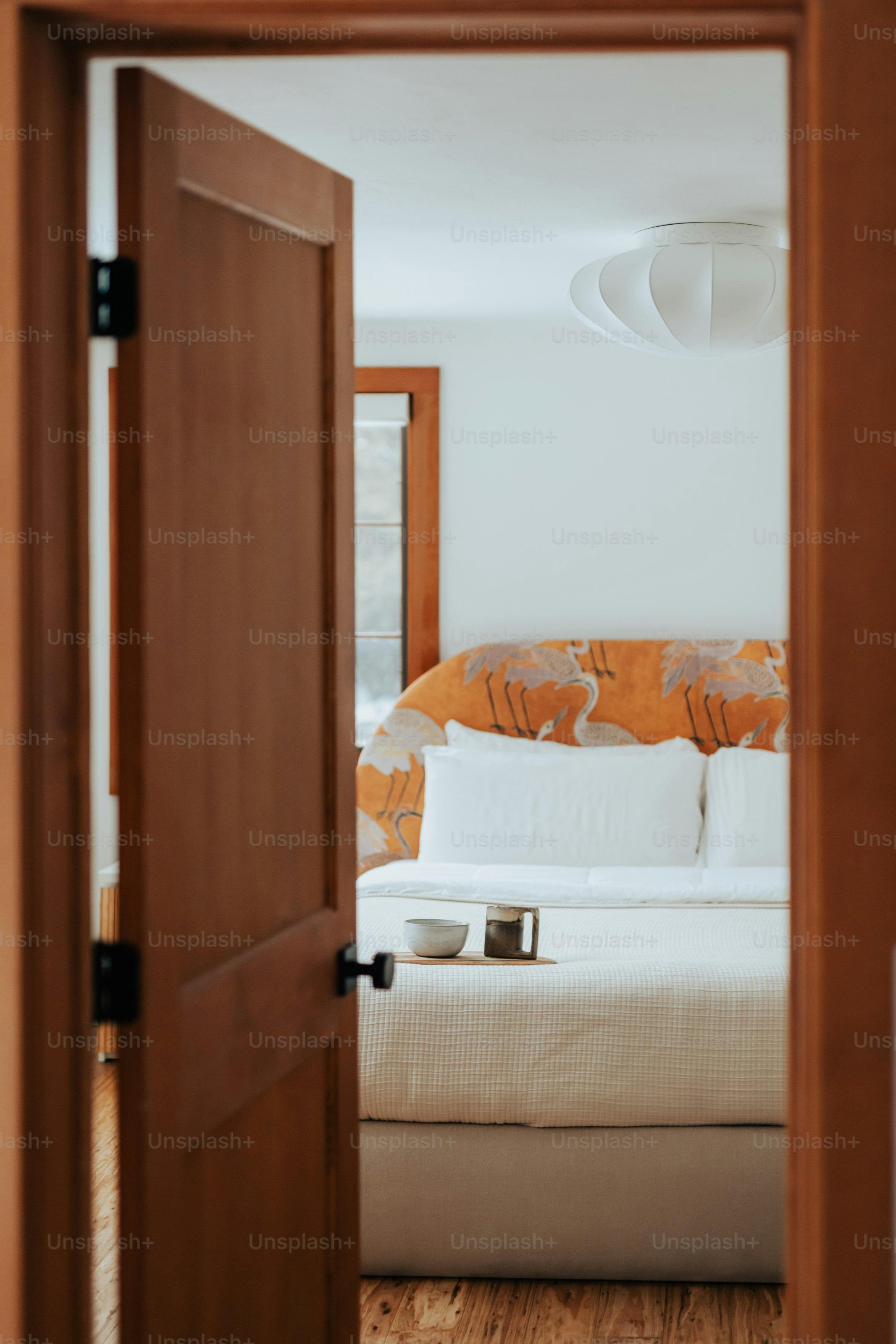 A bed sitting in a bedroom next to a doorway