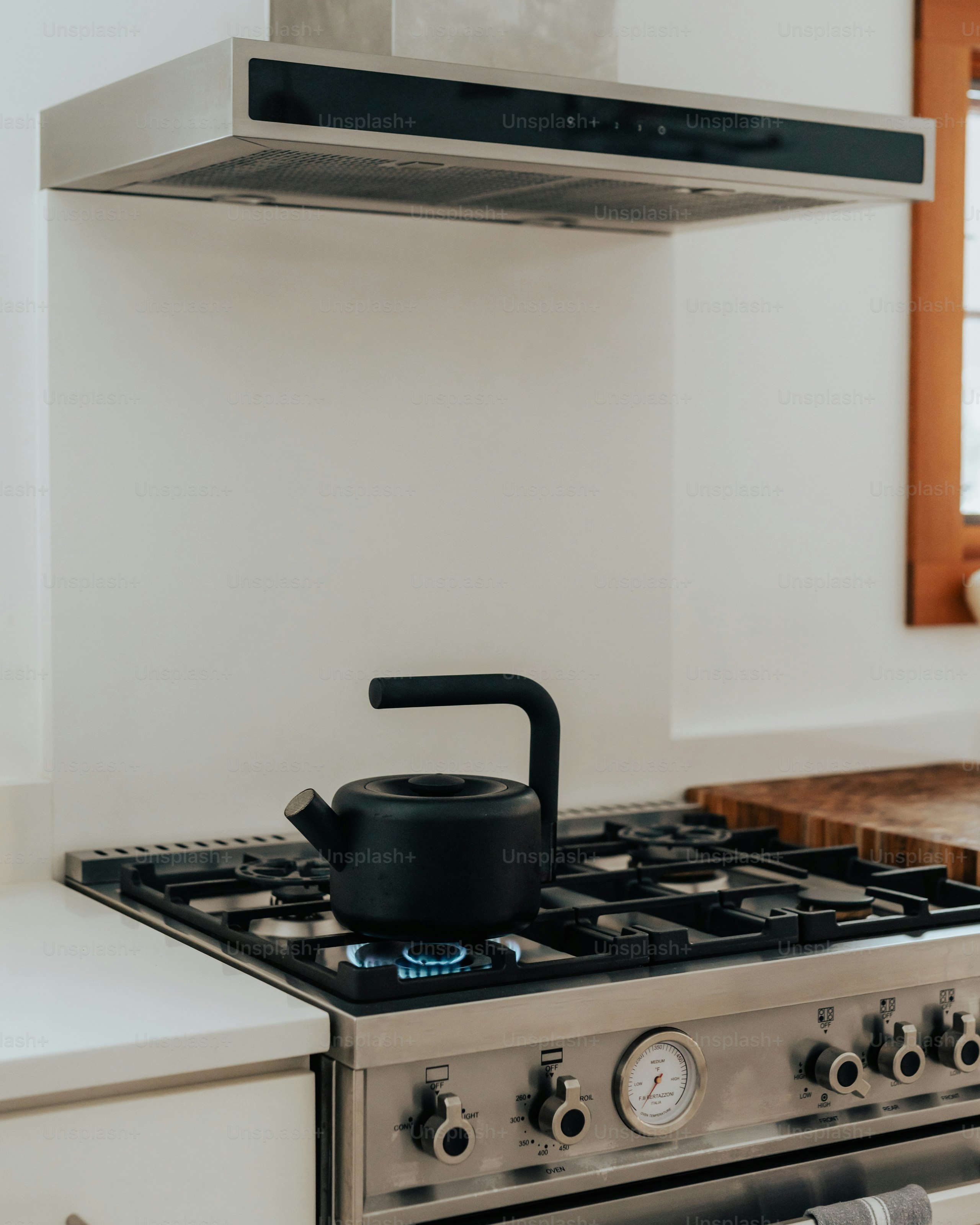 A stove top oven sitting inside of a kitchen
