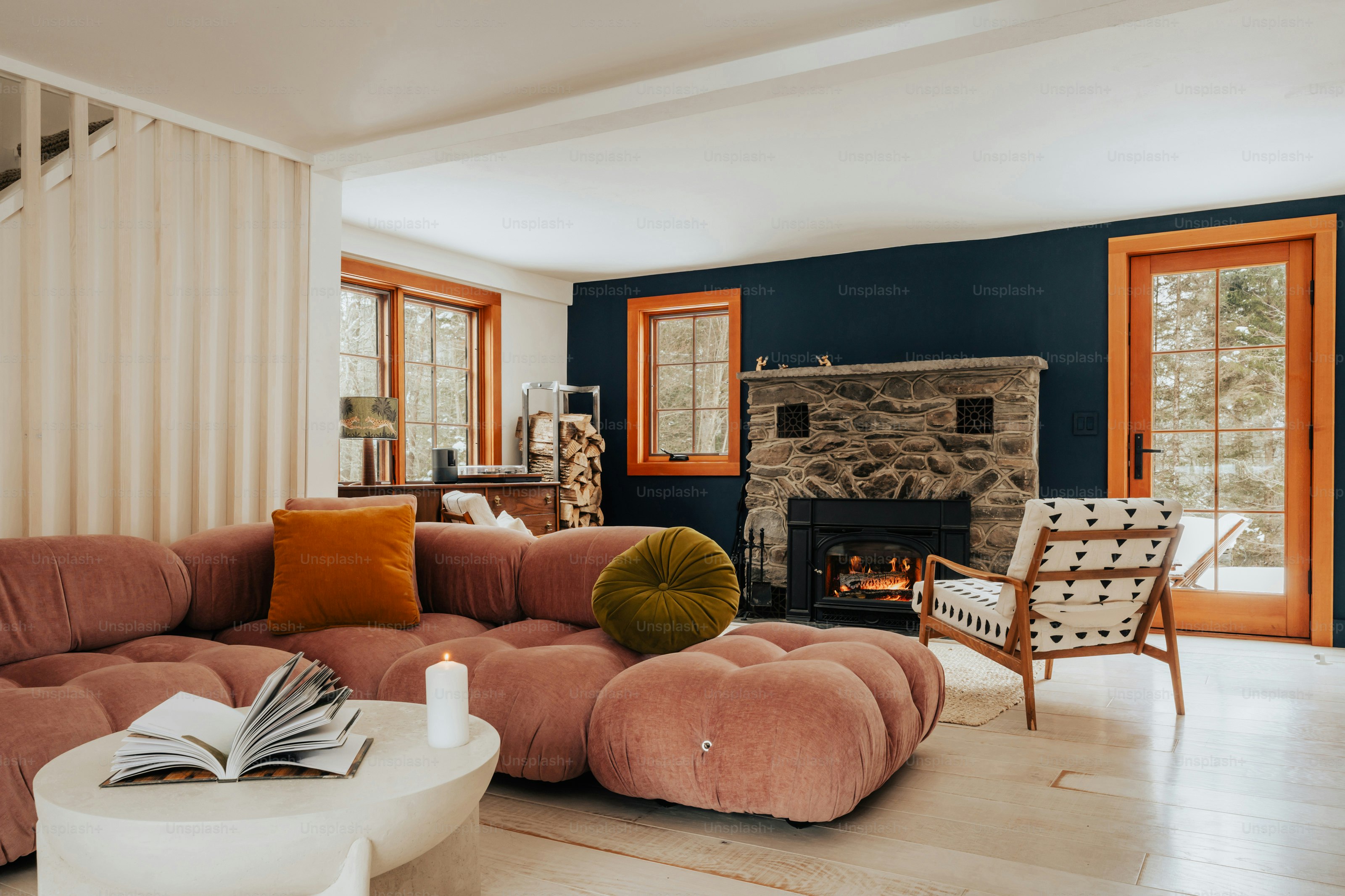 A living room filled with furniture and a fire place