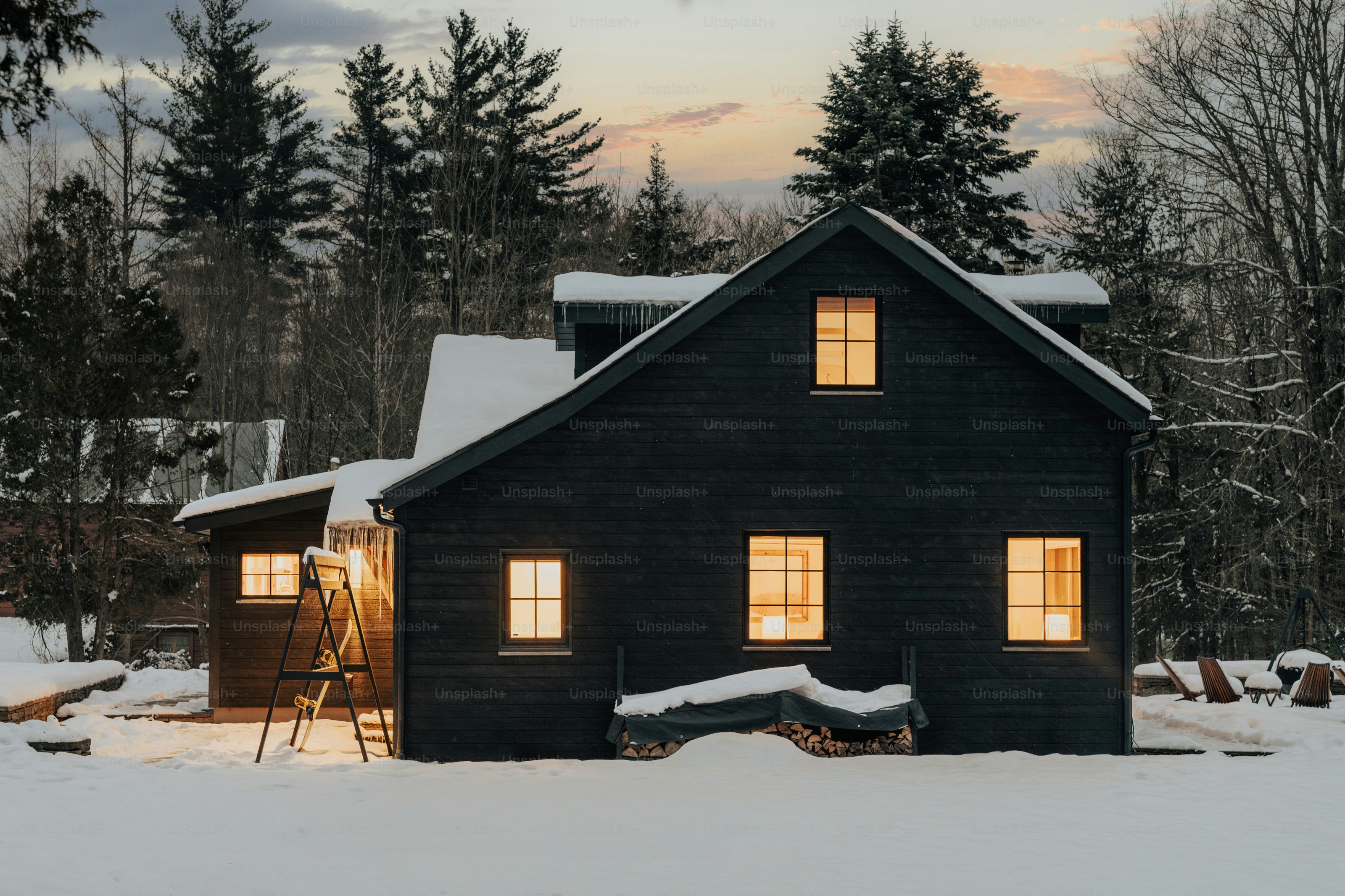 A house with a lot of snow on the ground