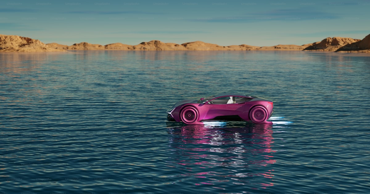 A pink car floating on top of a body of water photo – Water vehicle ...