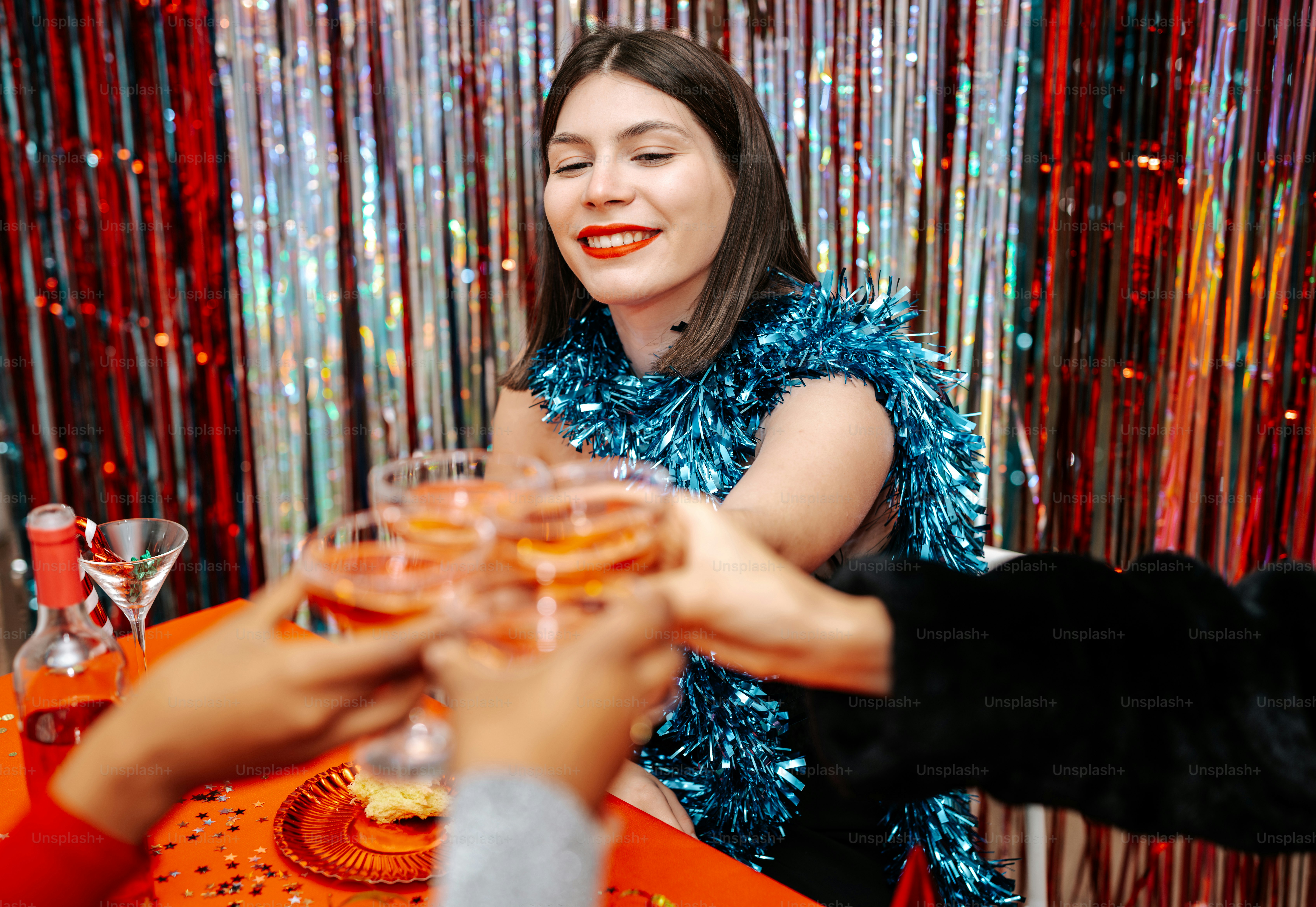 A group of people sitting around a table with wine glasses photo ...