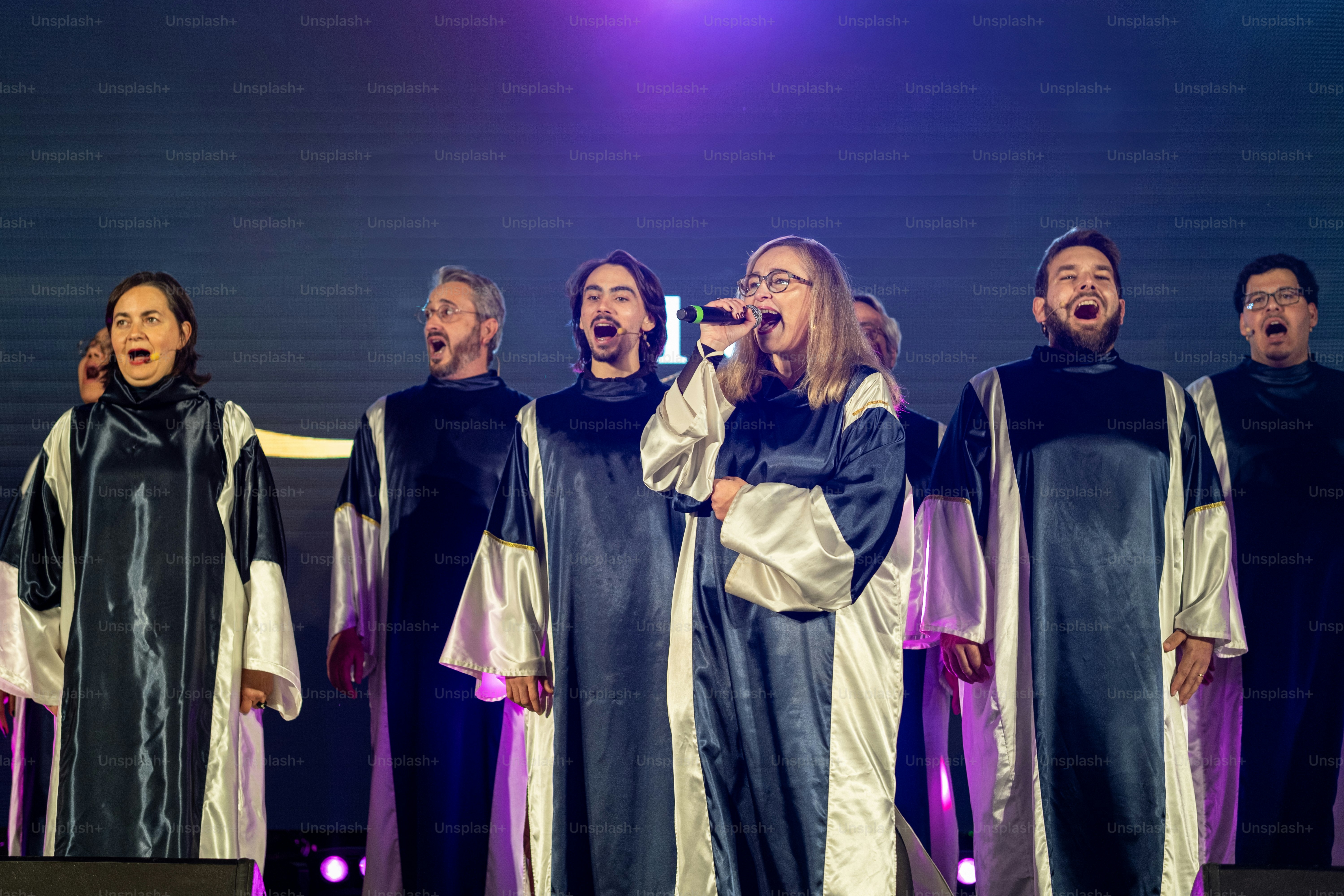 A group of people that are standing on a stage