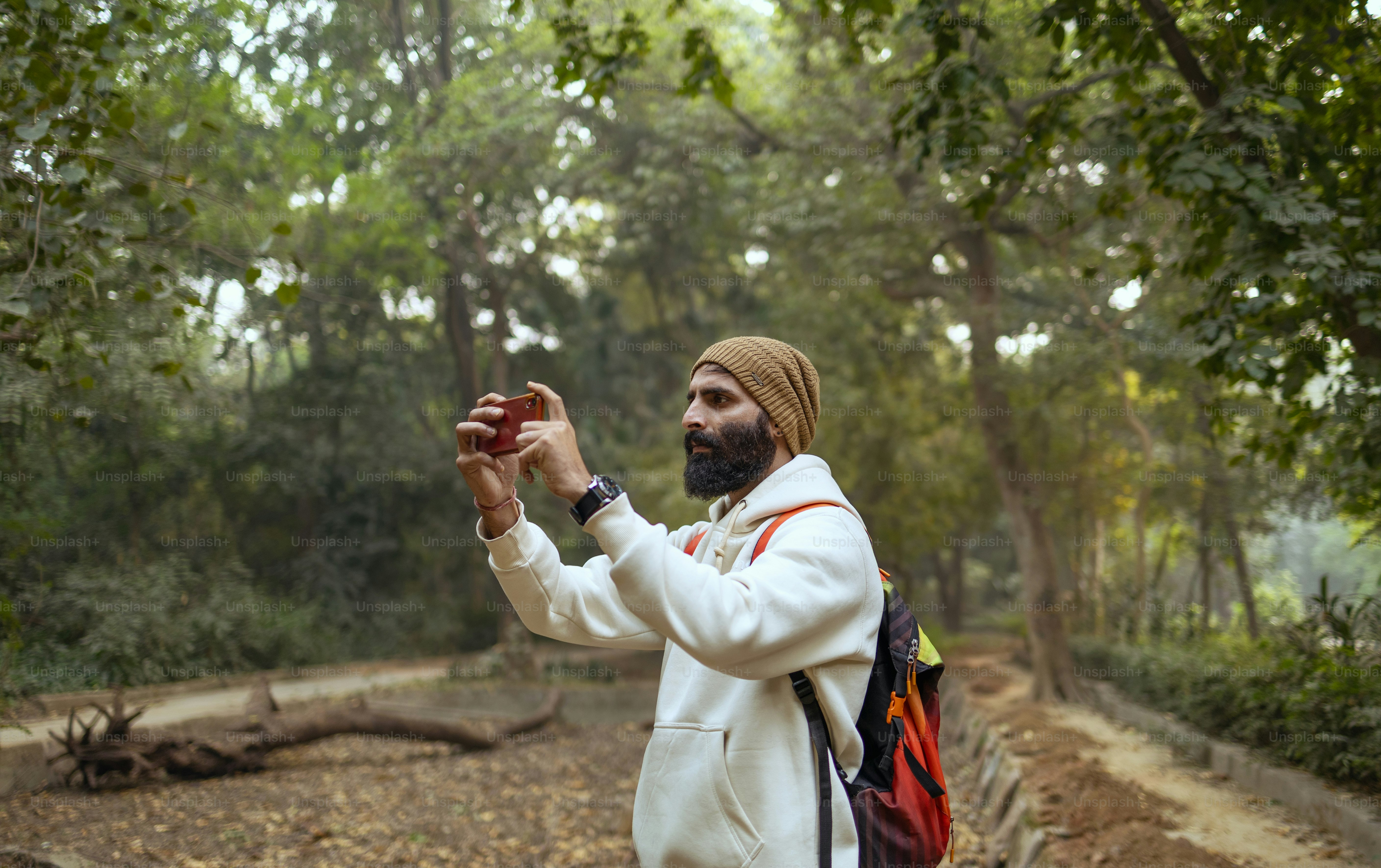 A man with a beard and turban holding something in his hands