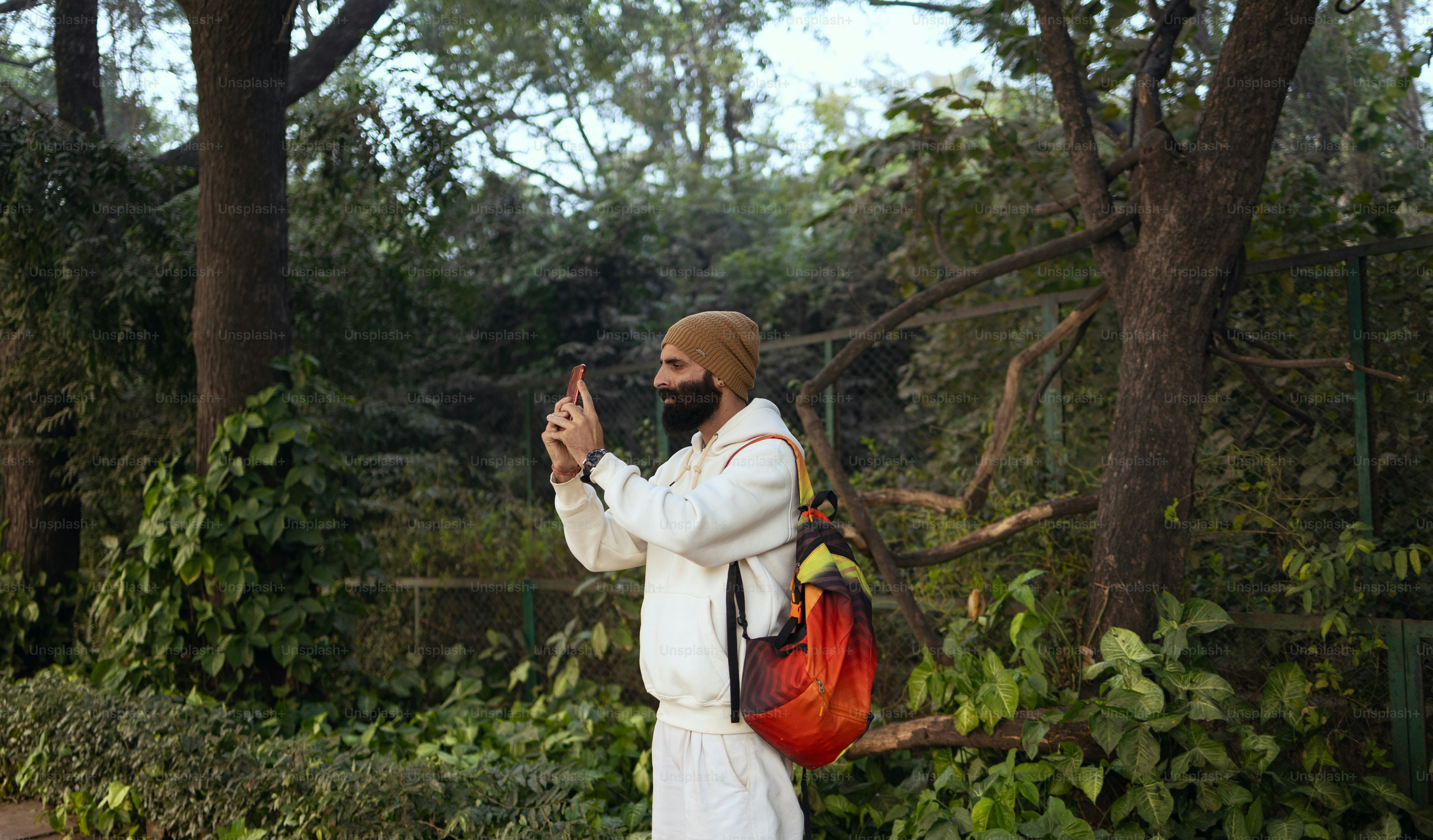 A man in a turban walking down a street