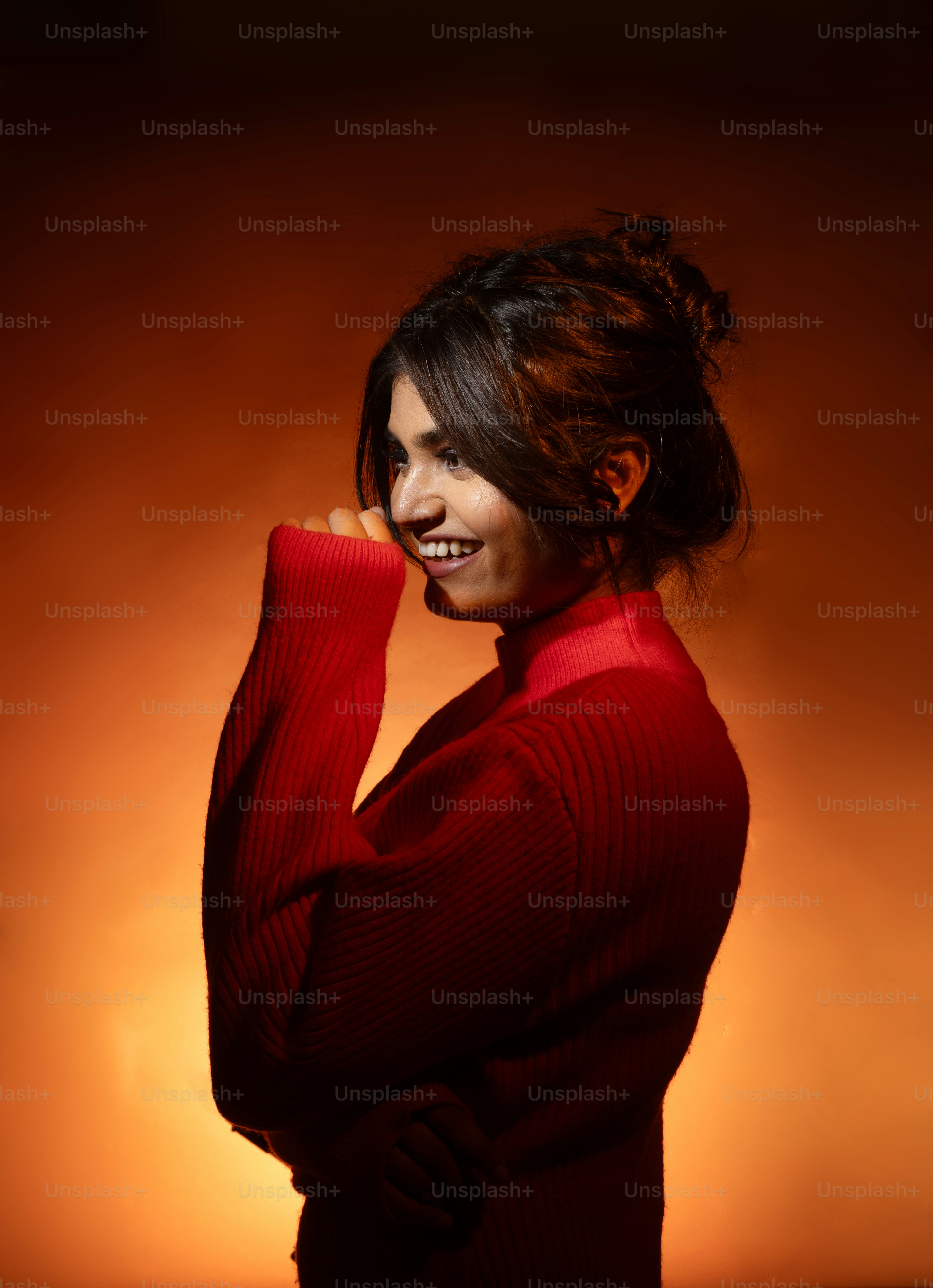 A woman in a red sweater posing for a picture photo – Profile pic Image ...