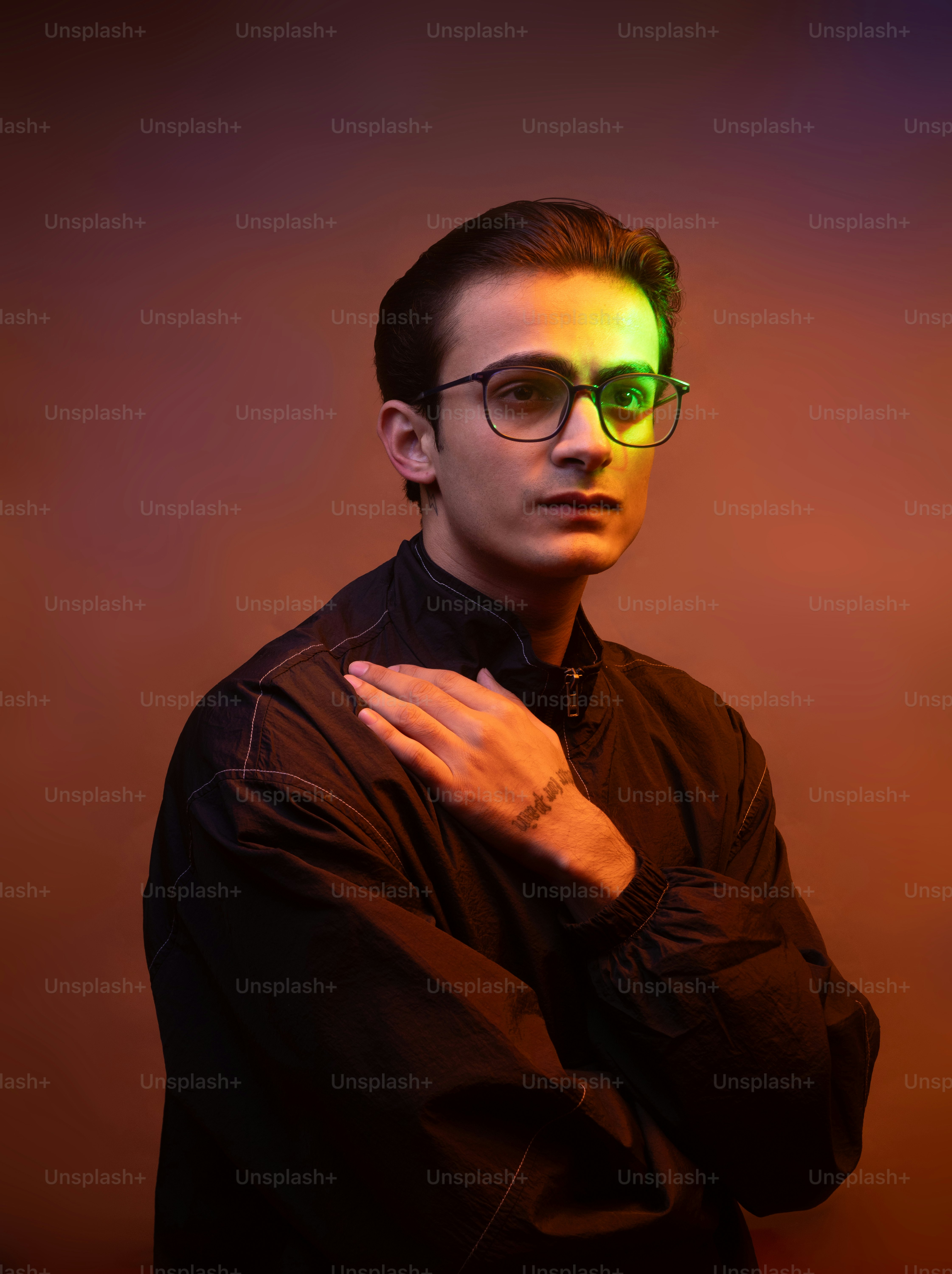 A man wearing glasses and a black shirt