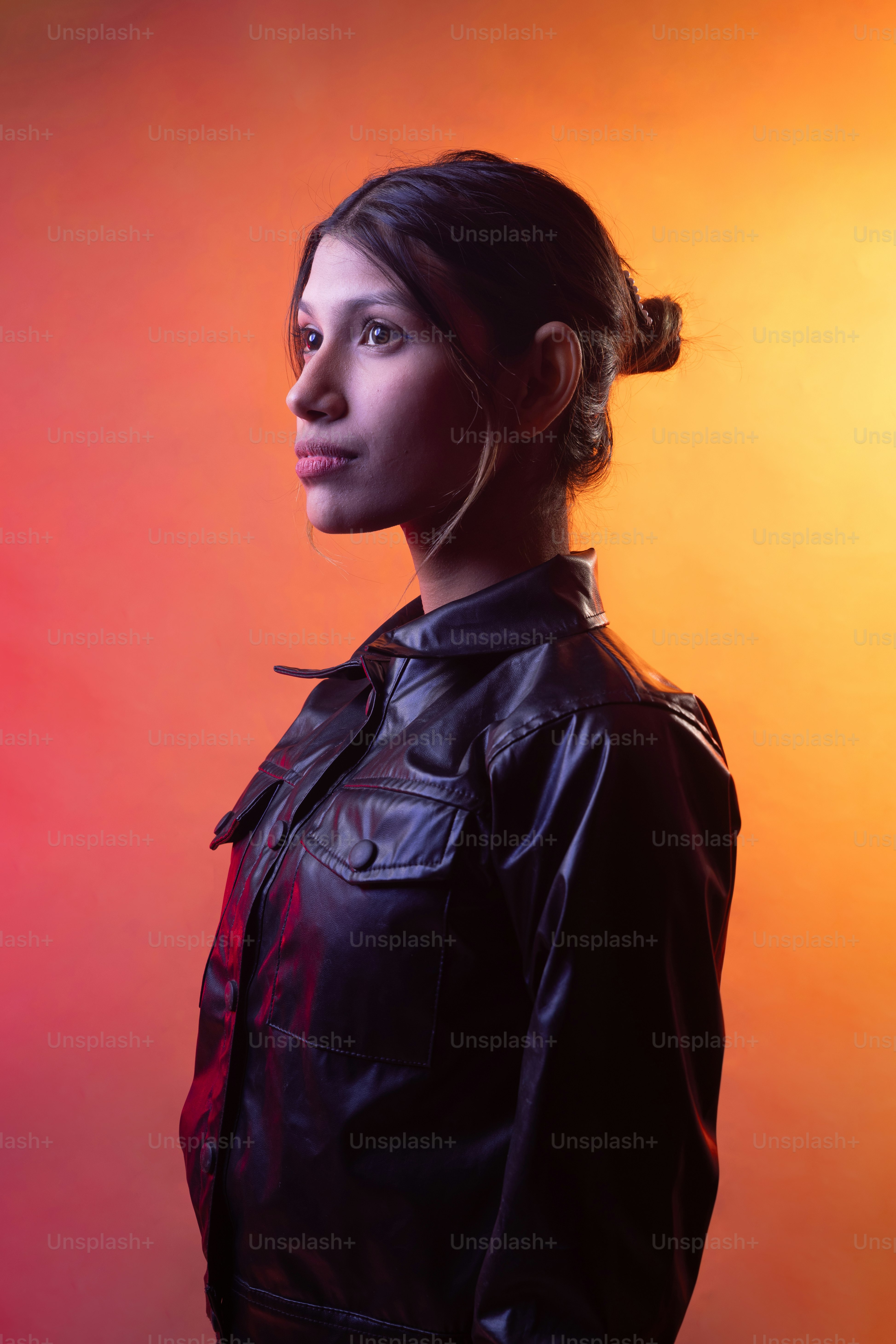 A woman in a leather jacket posing for a picture photo – Portrait Image ...
