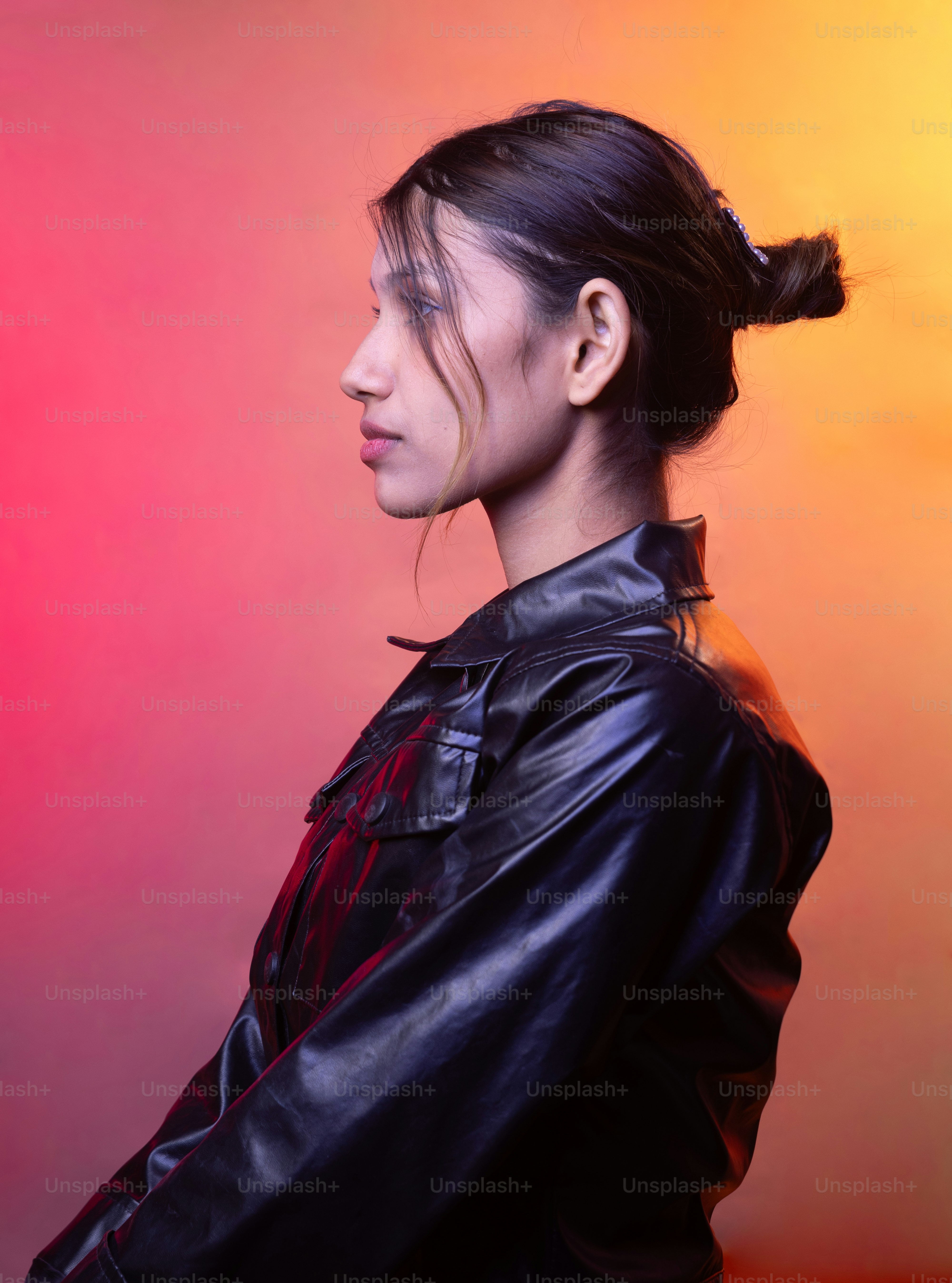 A woman in a black leather jacket is posing for a picture photo – Model ...
