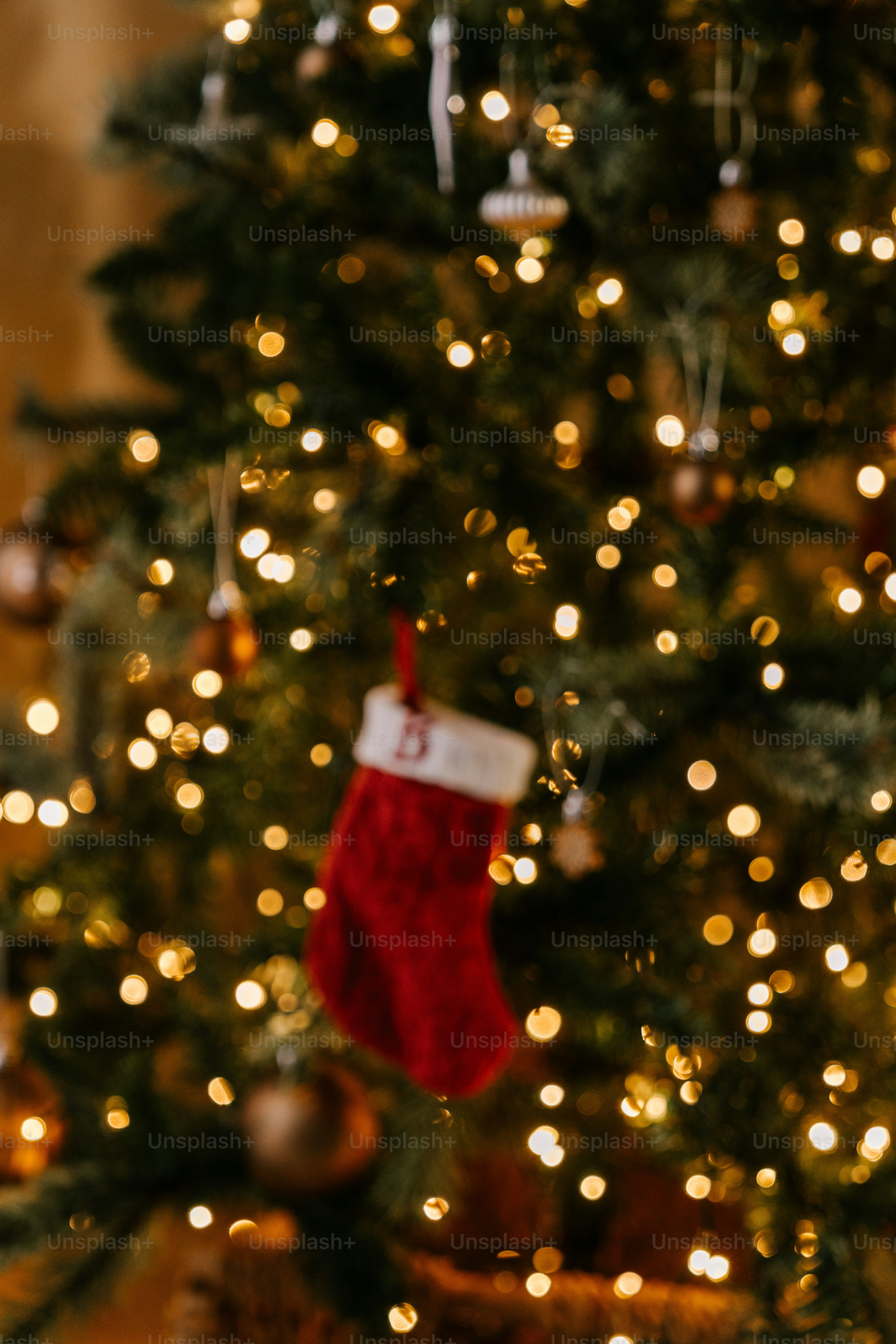 A christmas tree with a red stocking hanging from it