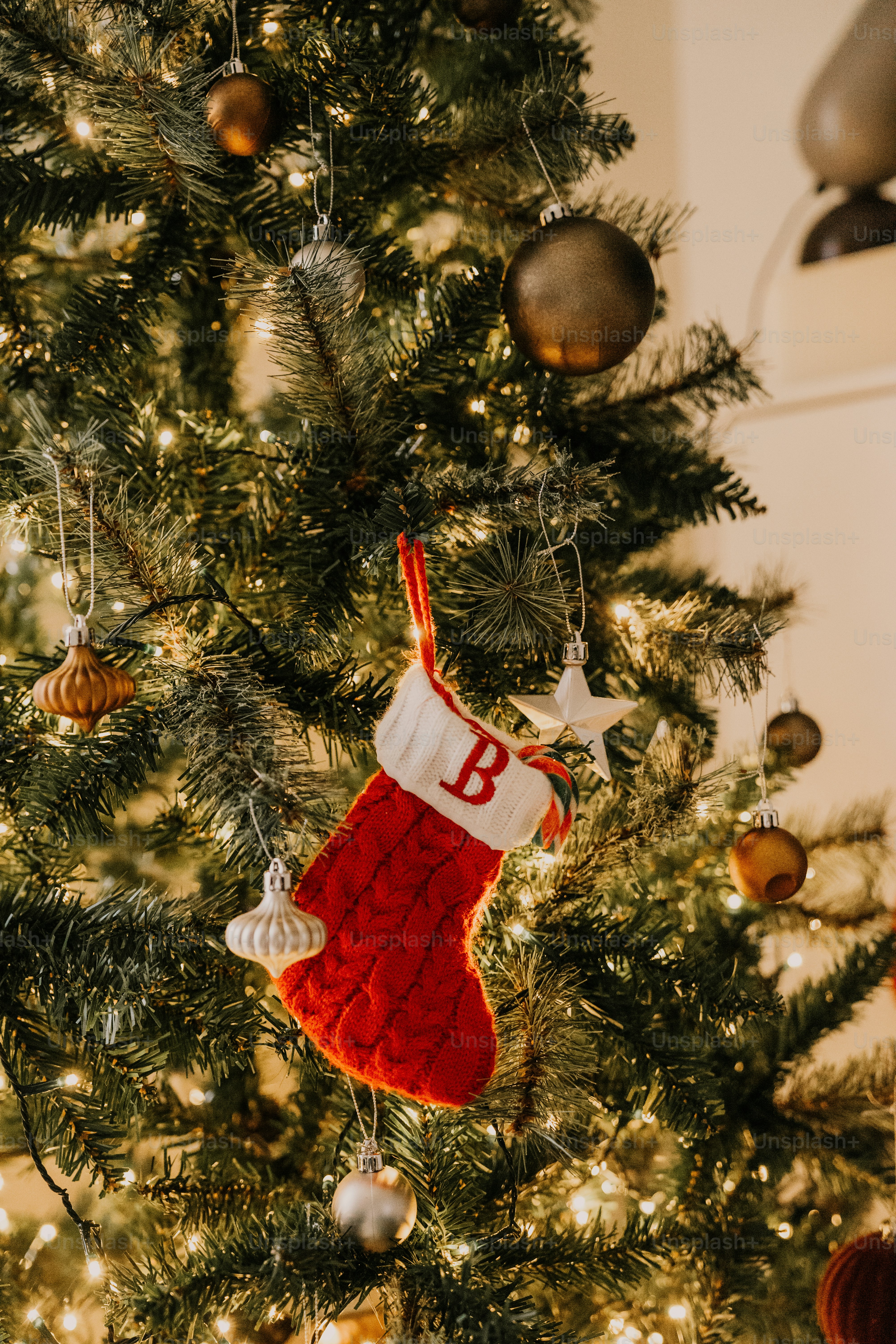 A christmas tree with a stocking hanging from it