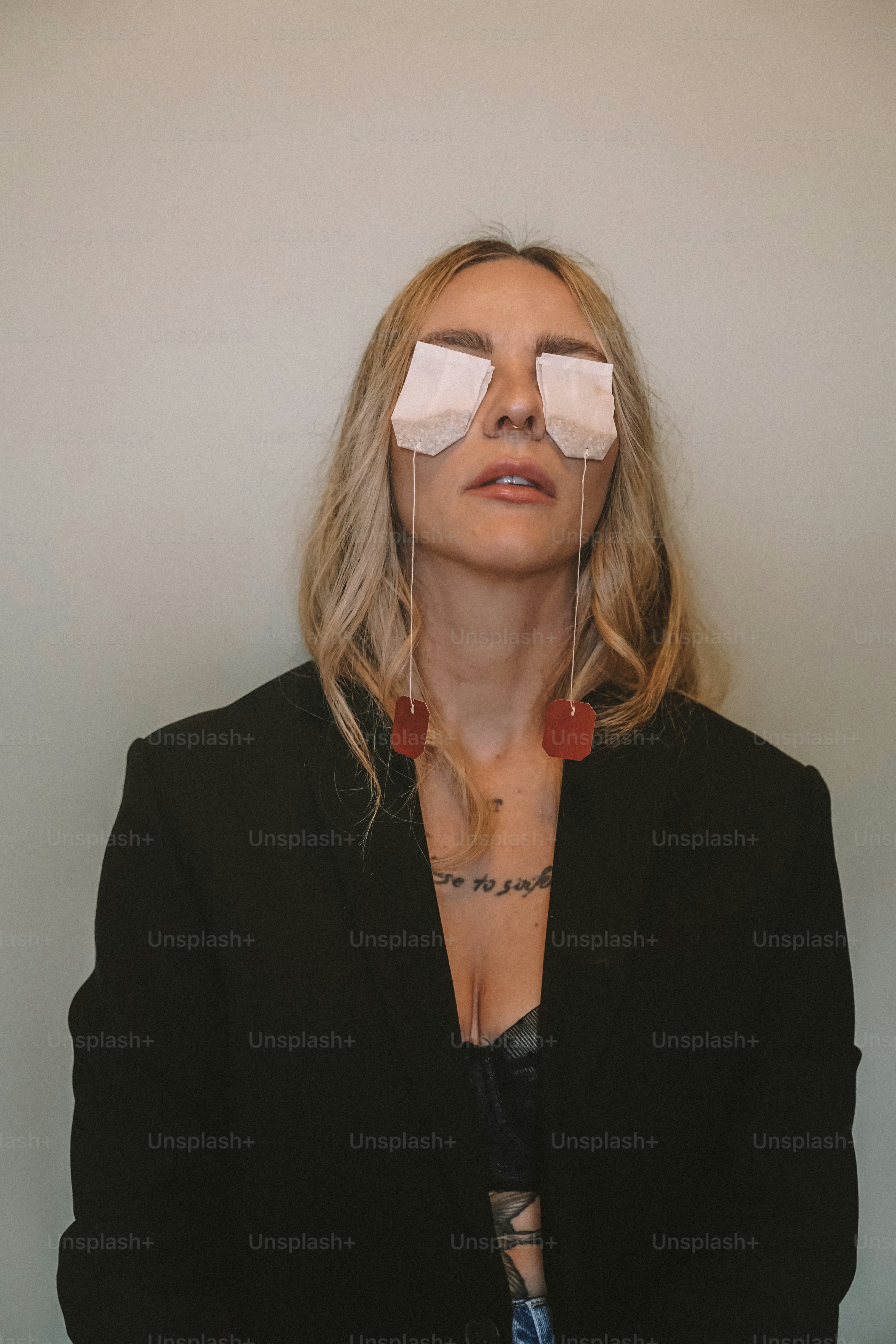 A woman with a pair of blindfolds over her eyes