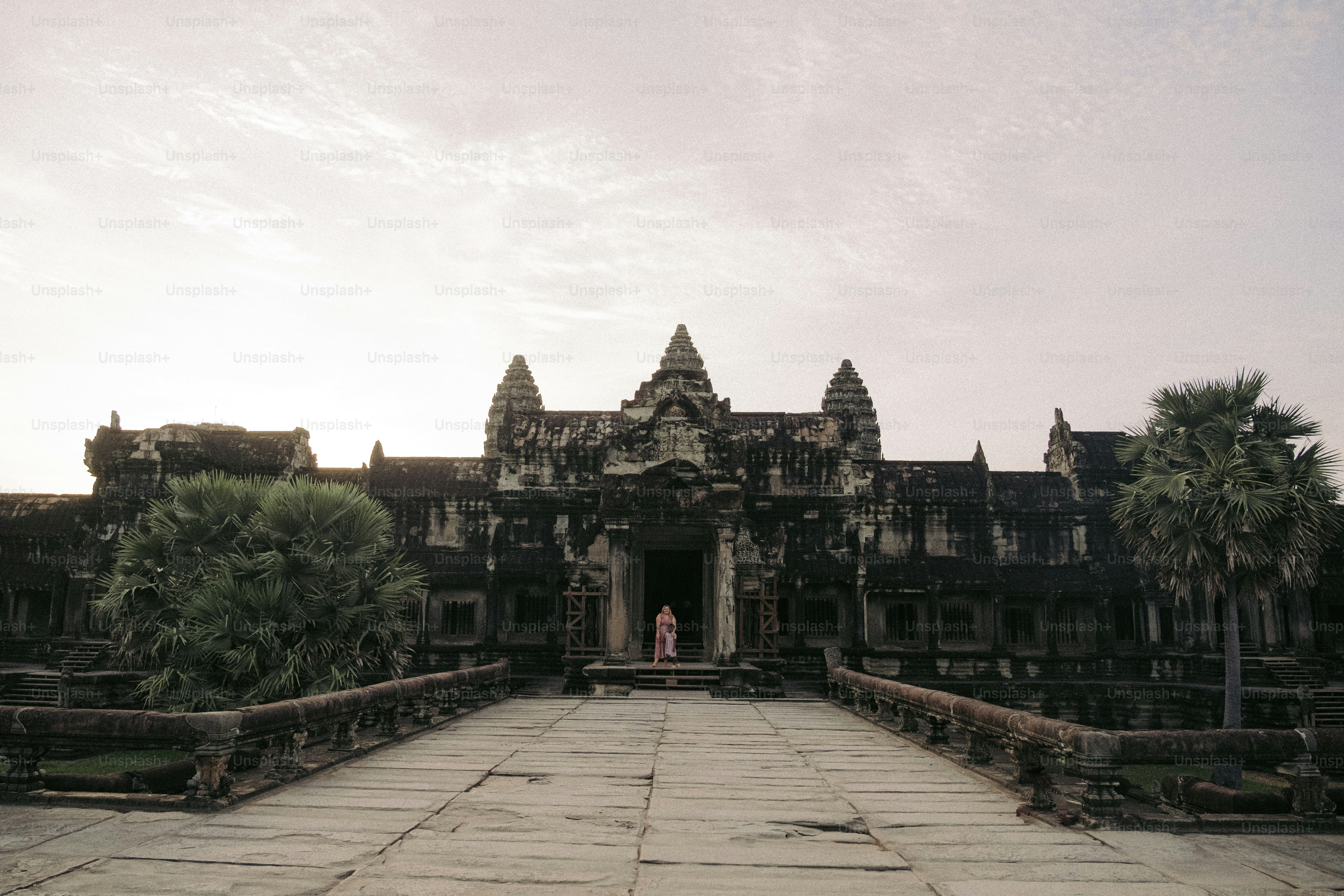 A large stone building with a walkway leading to it