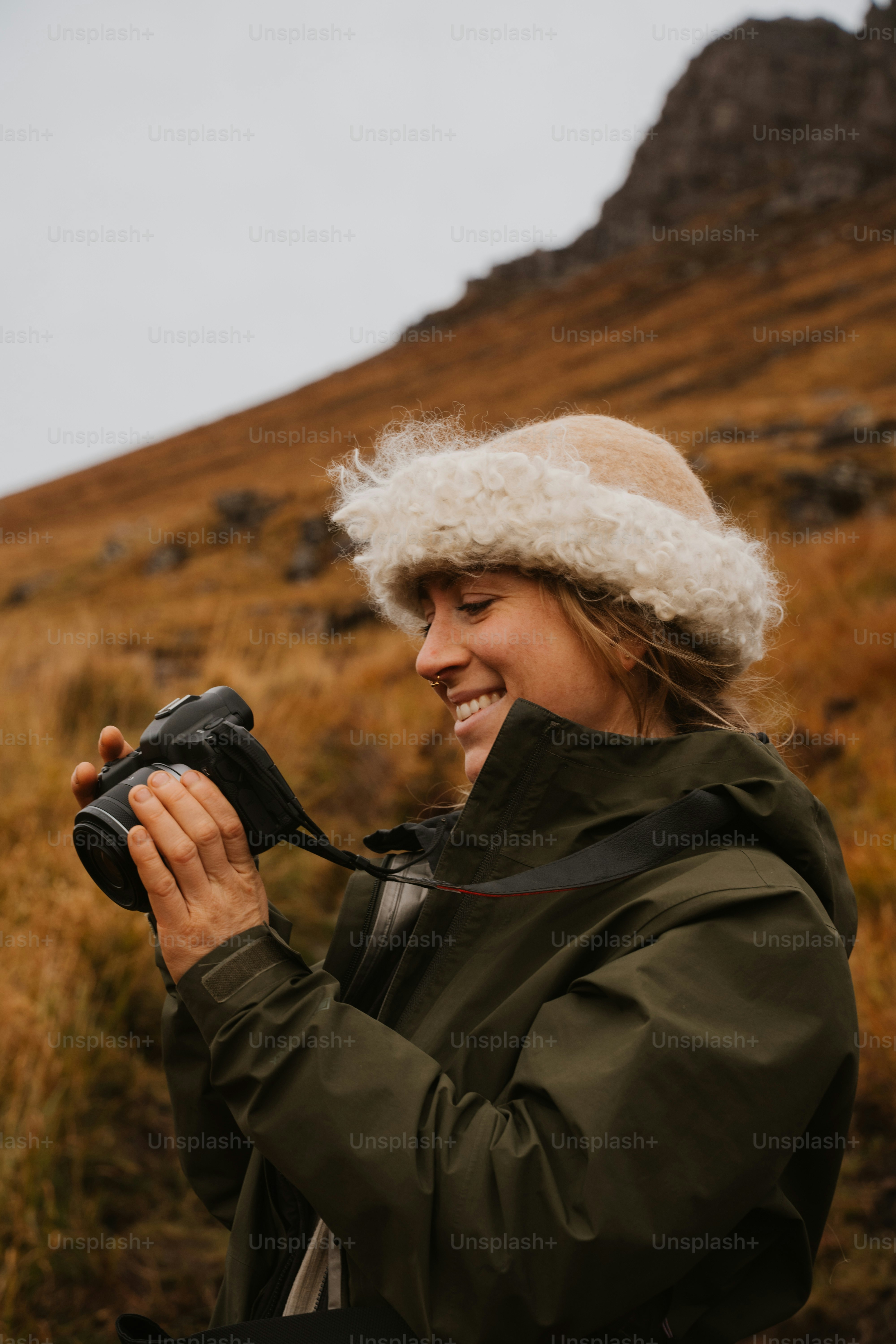 A woman is taking a picture with a camera