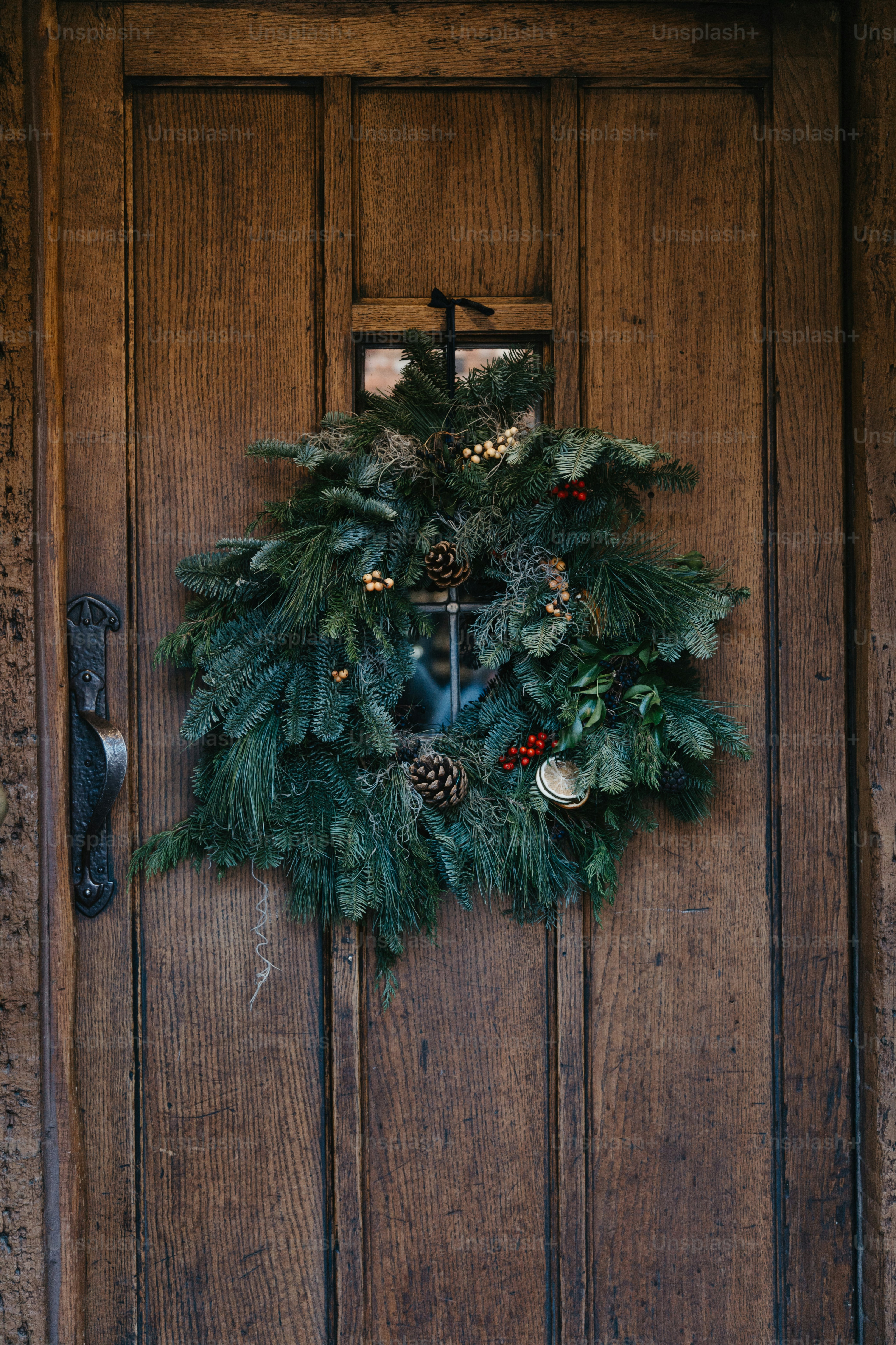 A wooden door with a wreath on it