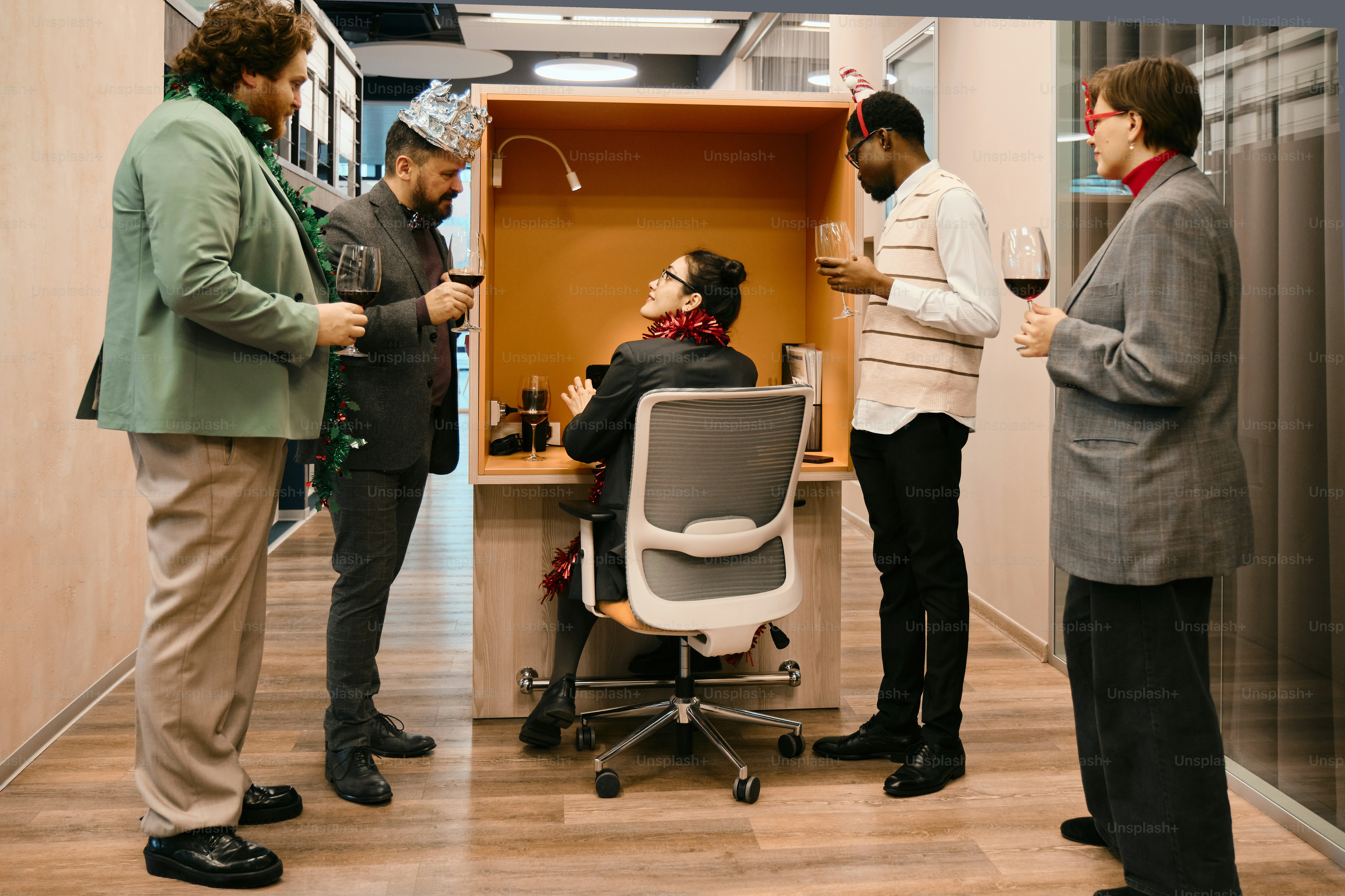 A group of men standing around a desk