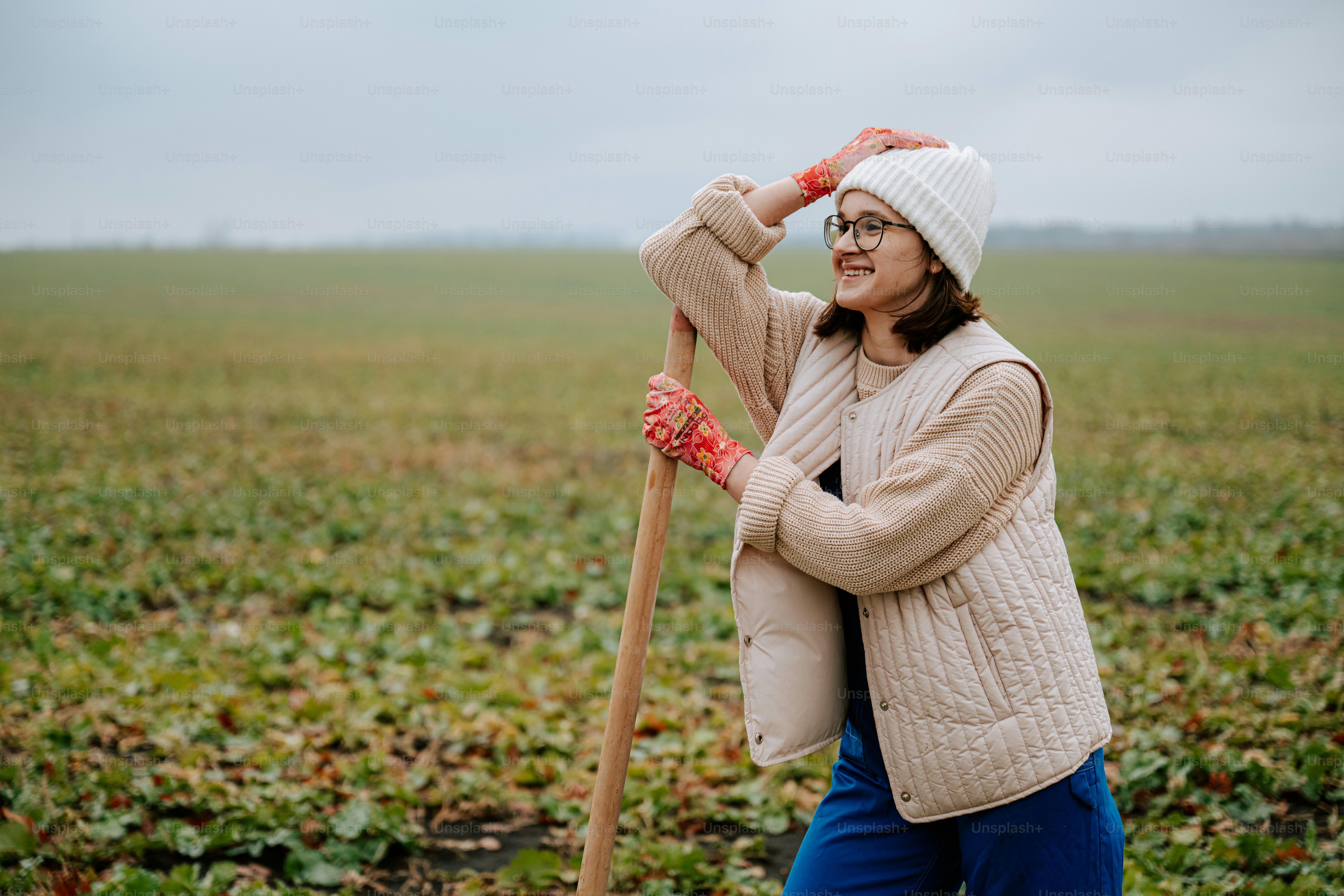 A woman in overalls holding a bucket and a dog photo – Farm Image on ...