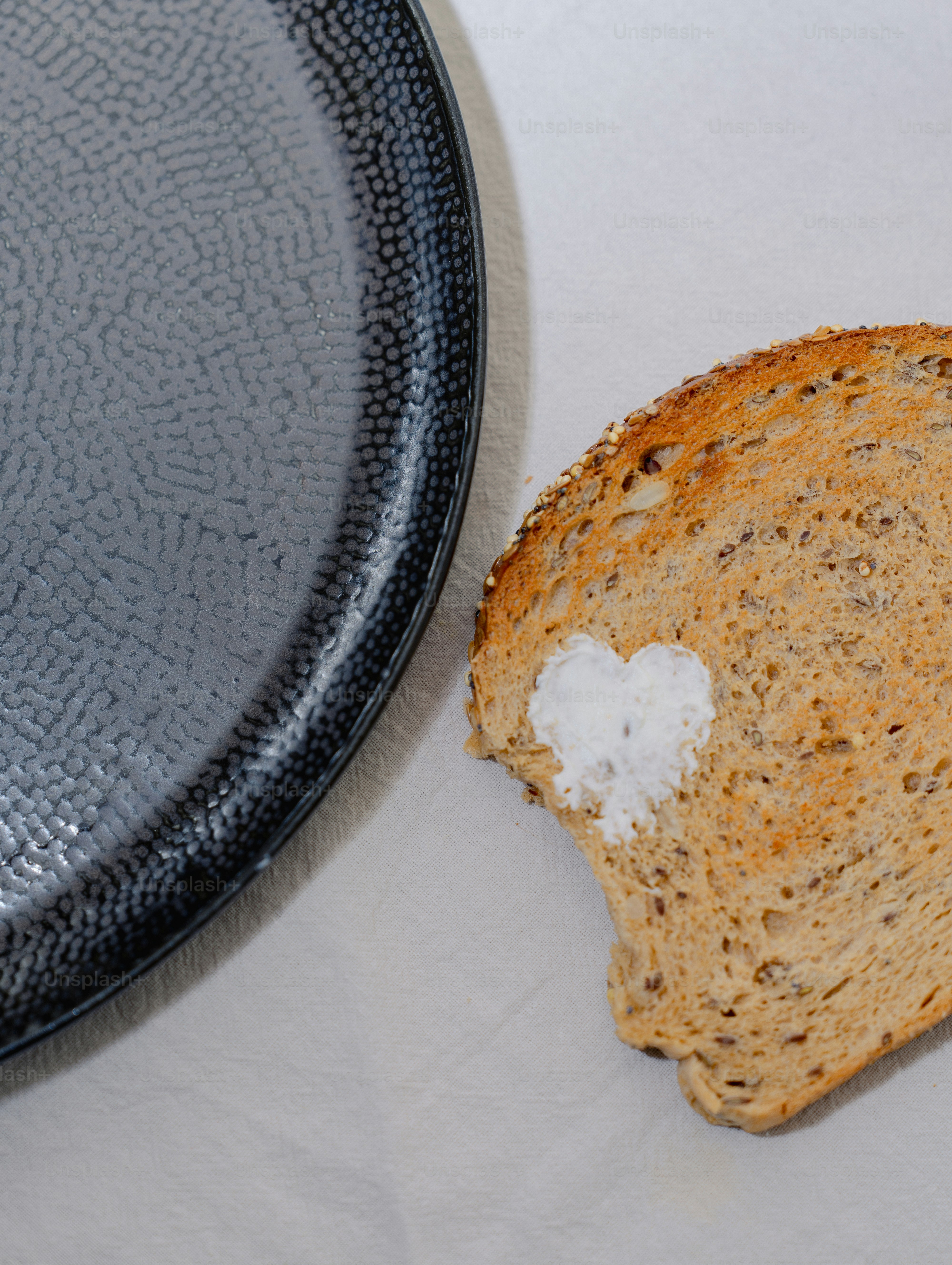 A piece of bread sitting on top of a white table