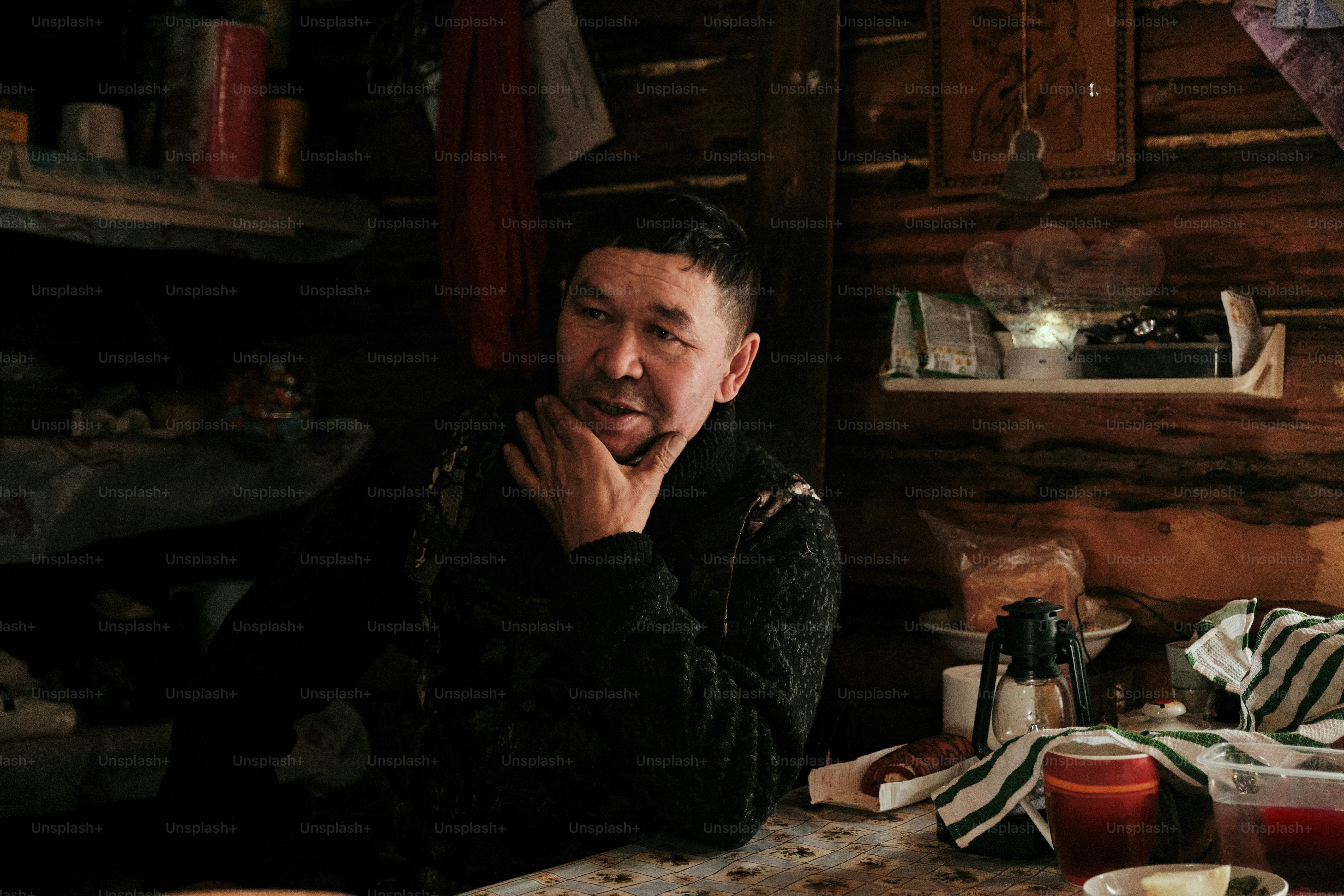 A man sitting at a table with food on it