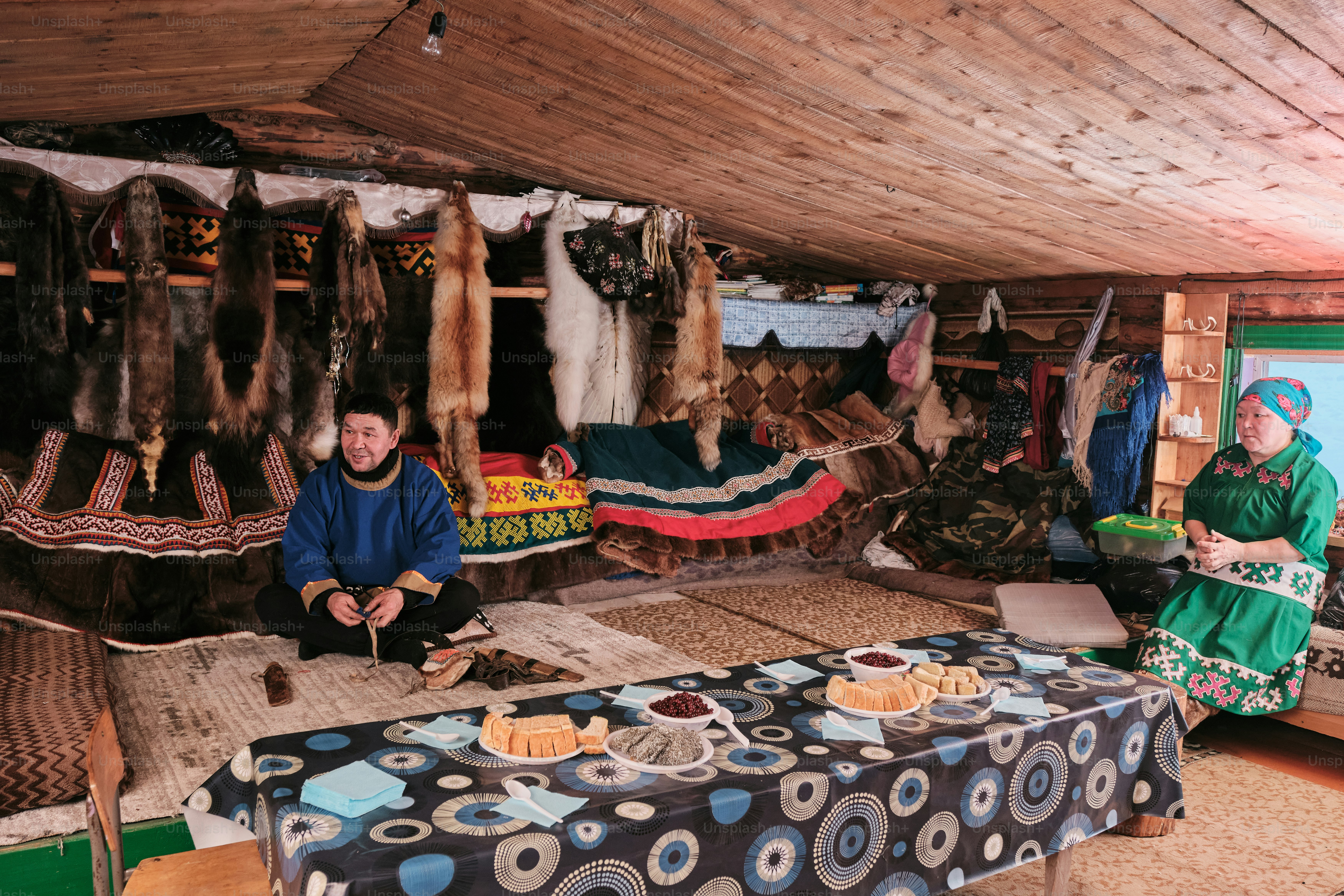 A group of people sitting around a table in a room