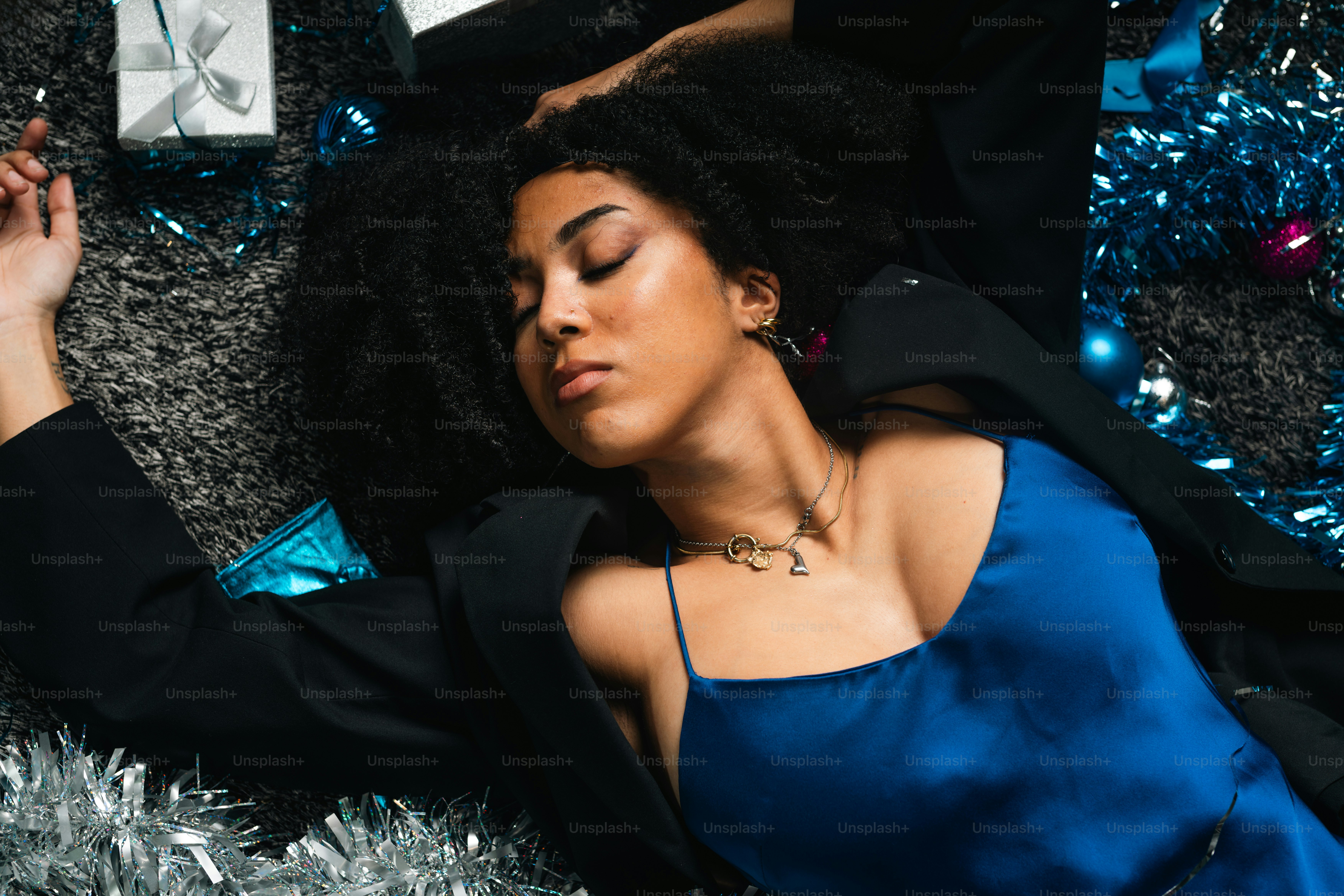 A woman in a blue dress laying on the floor photo – Fashion Image on ...