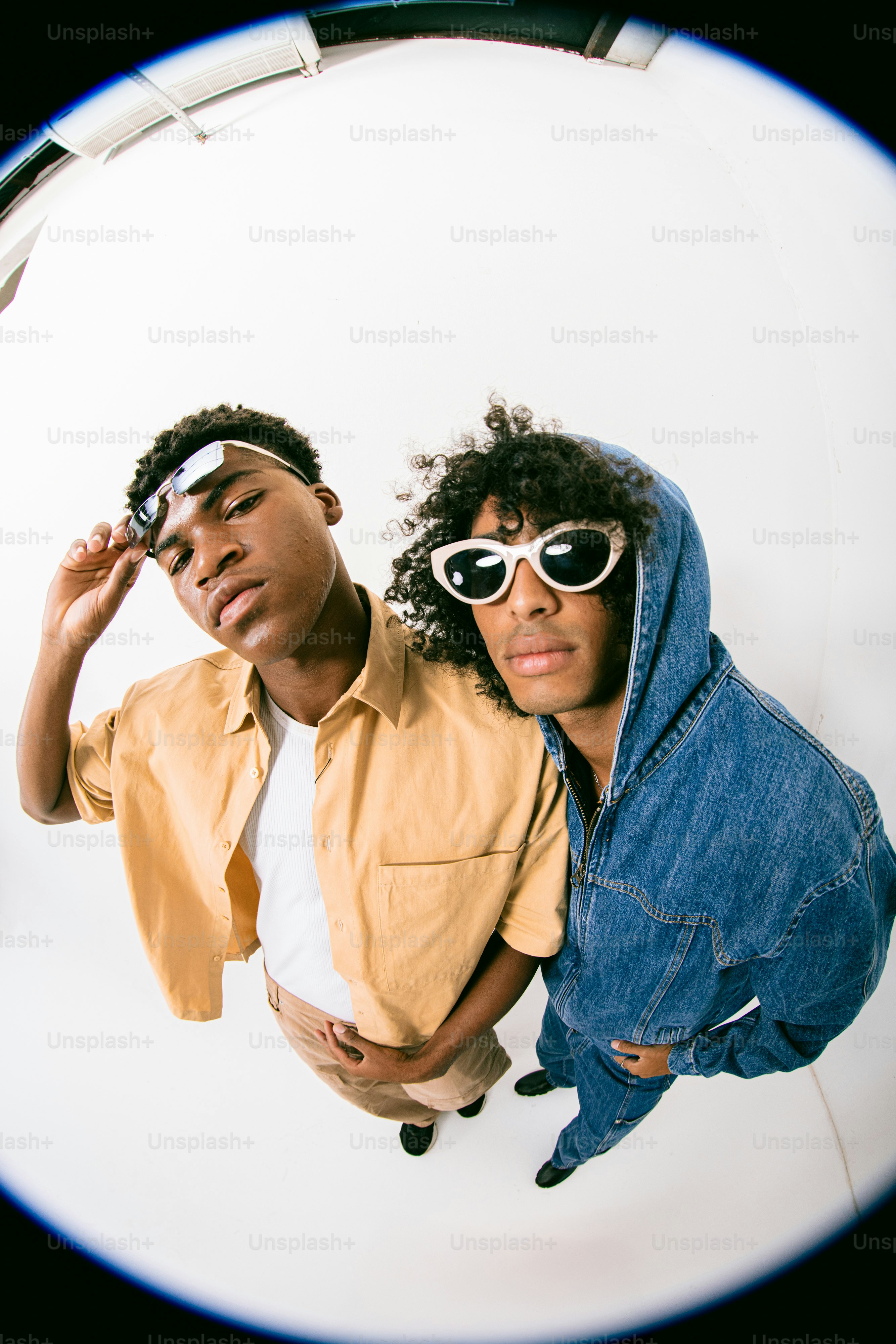 A couple of young men standing next to each other