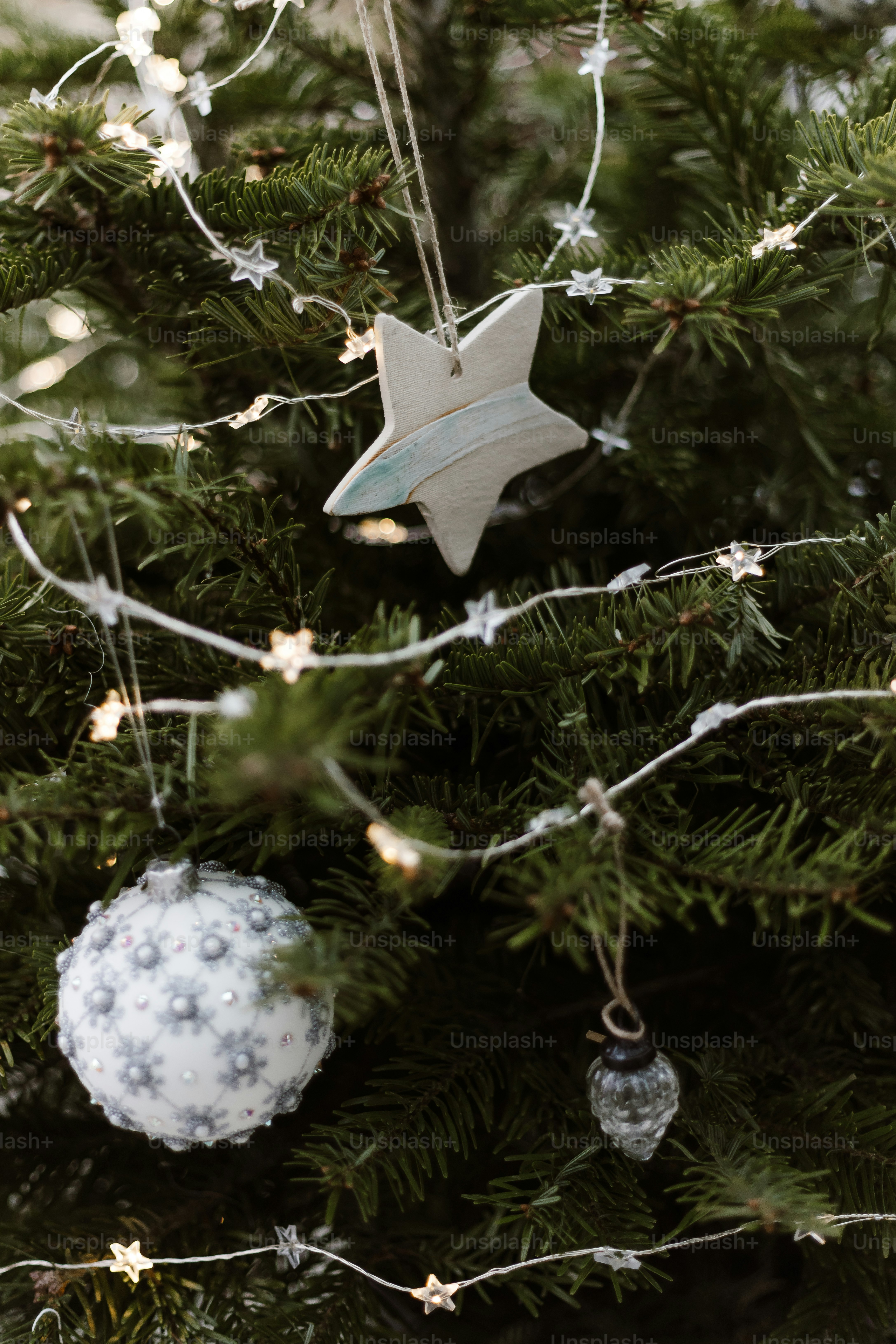A close up of a christmas tree with lights photo – Christmas Image on ...