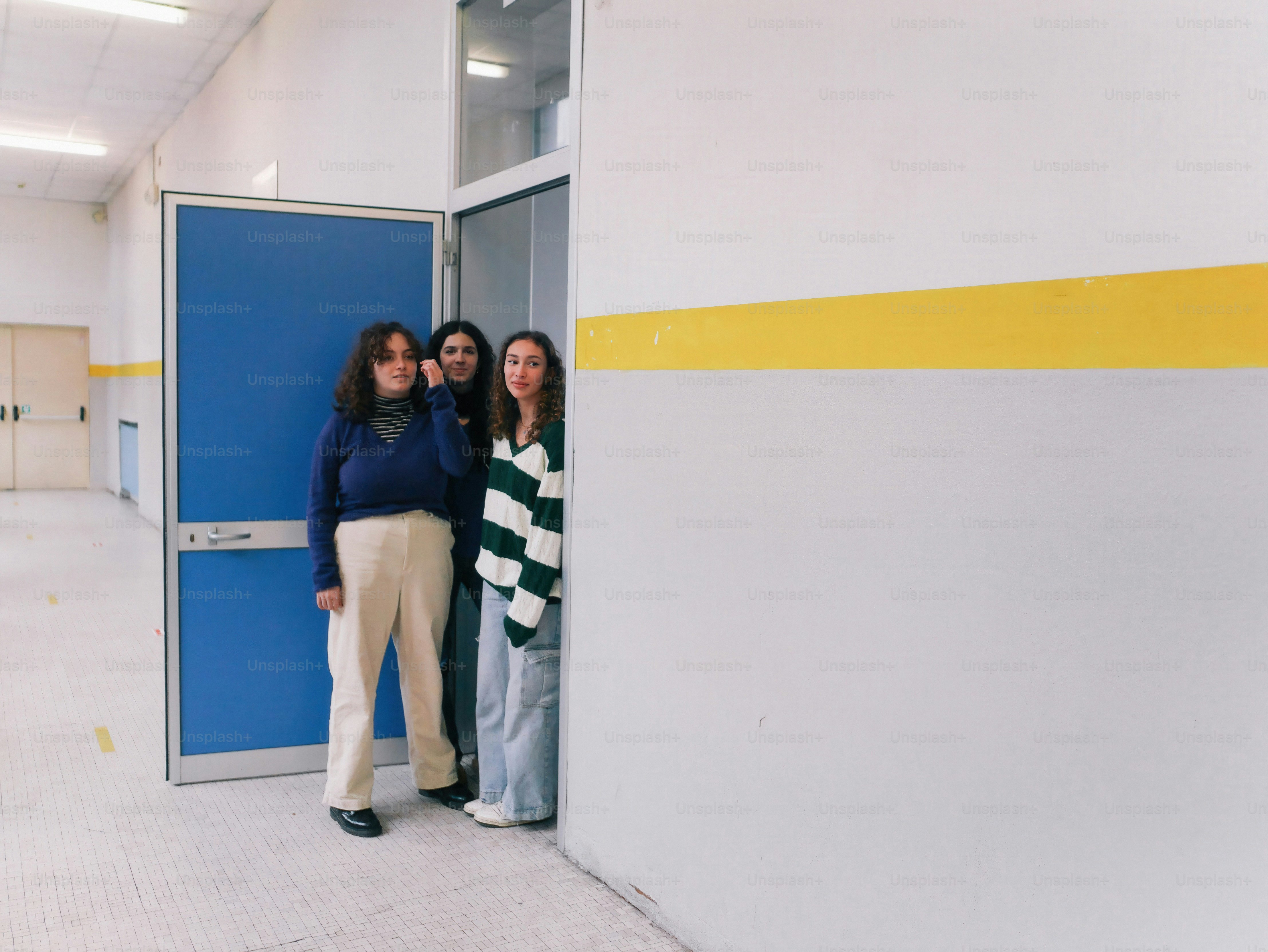 A group of people standing in a room
