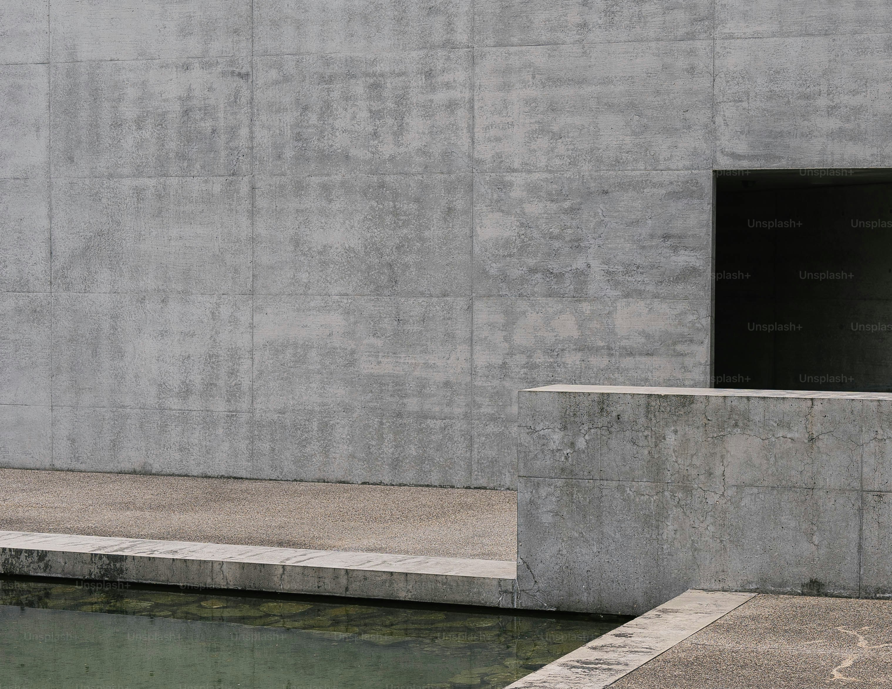 A man riding a skateboard next to a body of water
