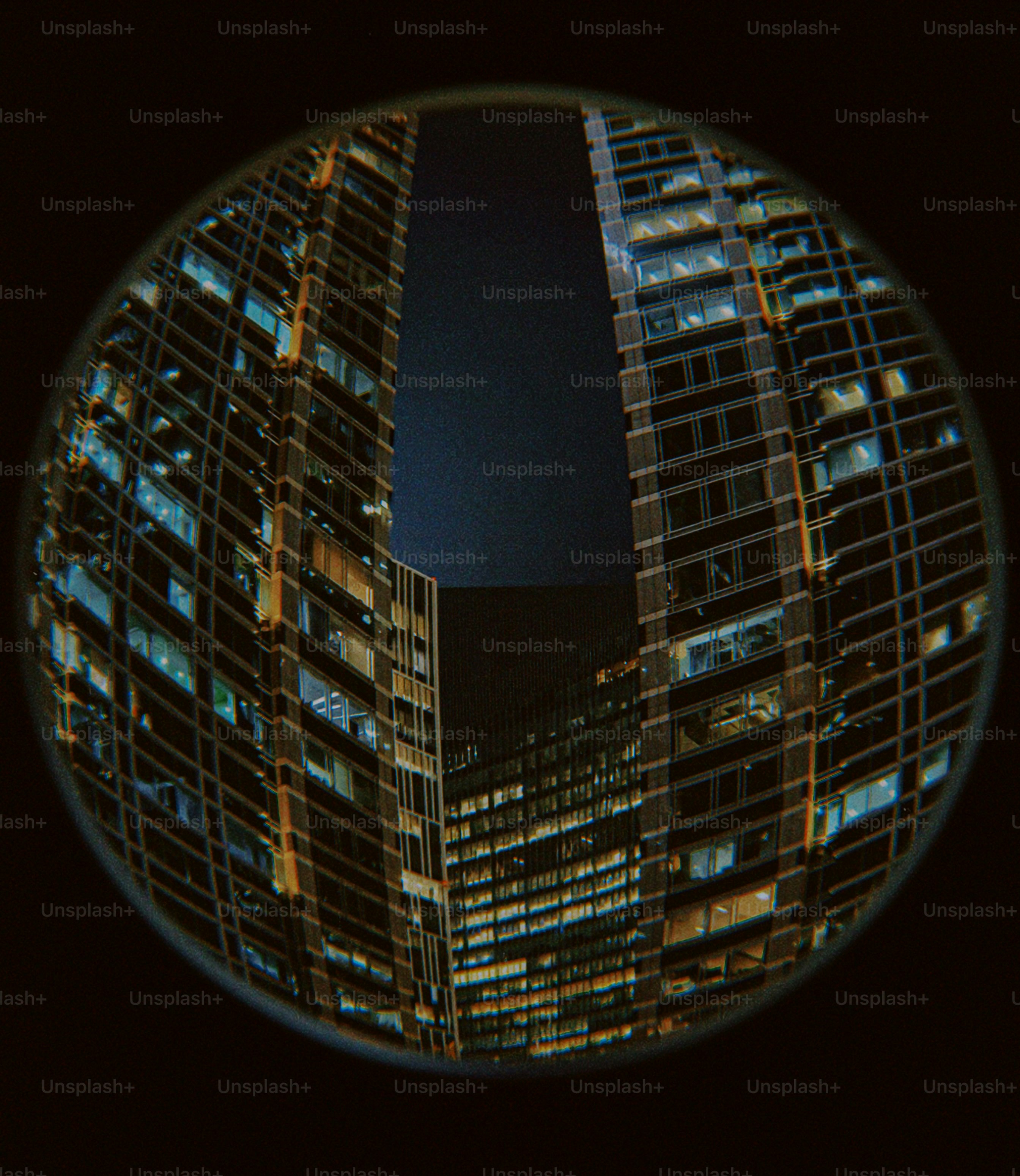 A circular picture of a city at night