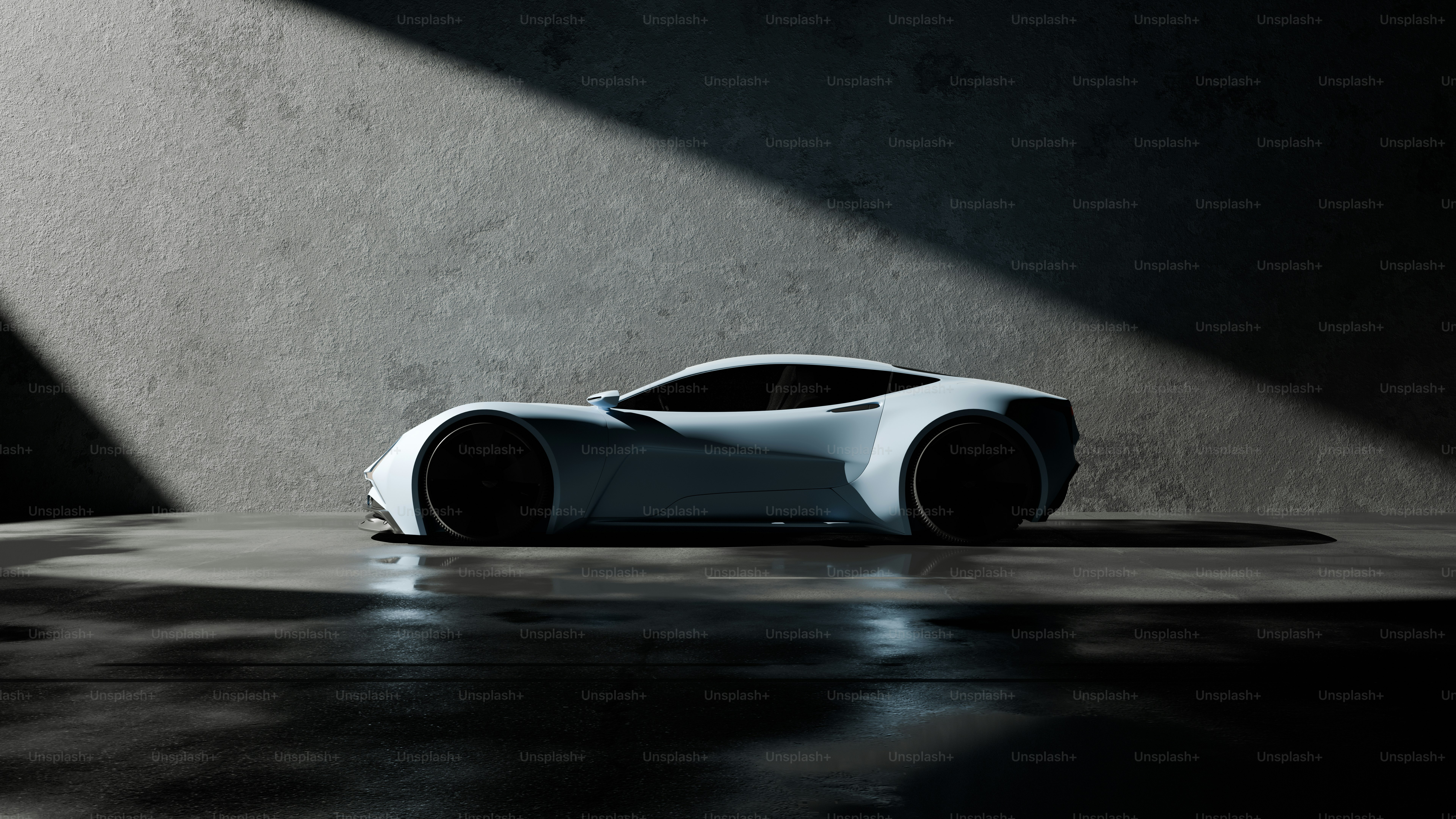 A white car sitting on top of a floor next to a wall